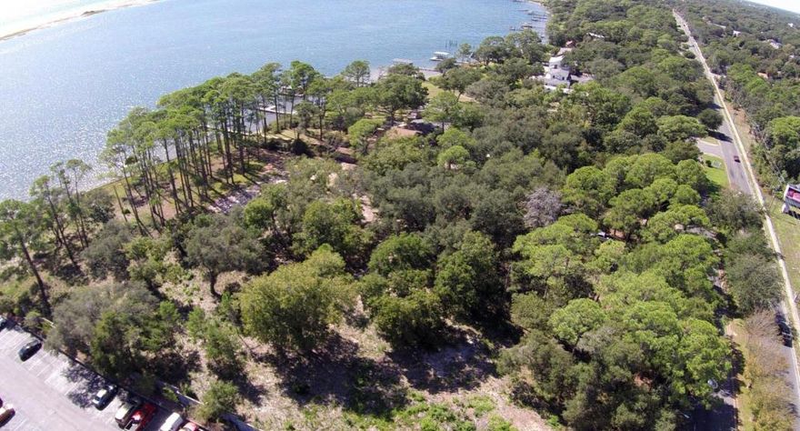 Coveted 3.18 acres of prime commercial land on Hwy 98 and the Sound. Rare opportunity to purchase property that has remained in the same family for generations and has been recently cleared with the removal of an old house. Scenic location is flanked by 314' water frontage and 250' of frontage on Hwy 98. The property is currently listed in Okaloosa County (but not within city limits) and can also be annexed into the City of Fort Walton Beach. County zoning is high density residential for up to 81 units and future land development is urban mixed use with the possibility of dividing. Motivated sellers and an ideal location will guarantee numerous inquiries and offers, so contact us immediately for more details.2nd parcel id# Any elevation above two stories will enjoy sweeping gulf vie