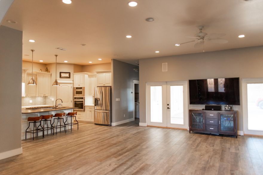 updated 3-Bedroom, 2-Bath Home that offers the main house with a spacious open floor plan.  newly installed LVP flooring,10-foot ceilings, and recessed lighting with controls. Privacy blinds throughout the home. Ample storage & brand-new stainless-steel appliances and a gas cooktop. There is a bonus room for an additional space for a home office or dining room. The primary bedroom includes an en-suite bathroom with tub and a Walk-in closet, and has outside access. The two additional bedrooms are ideal for family and guests. Enjoy a fenced backyard, gas grill and ample room for outdoor activities. 2 car garage with storageDisclosure: There is a bonus apartment on top of the separate garage, the right side and upstairs is rented. They are usually home on weeknights & gone weekends.