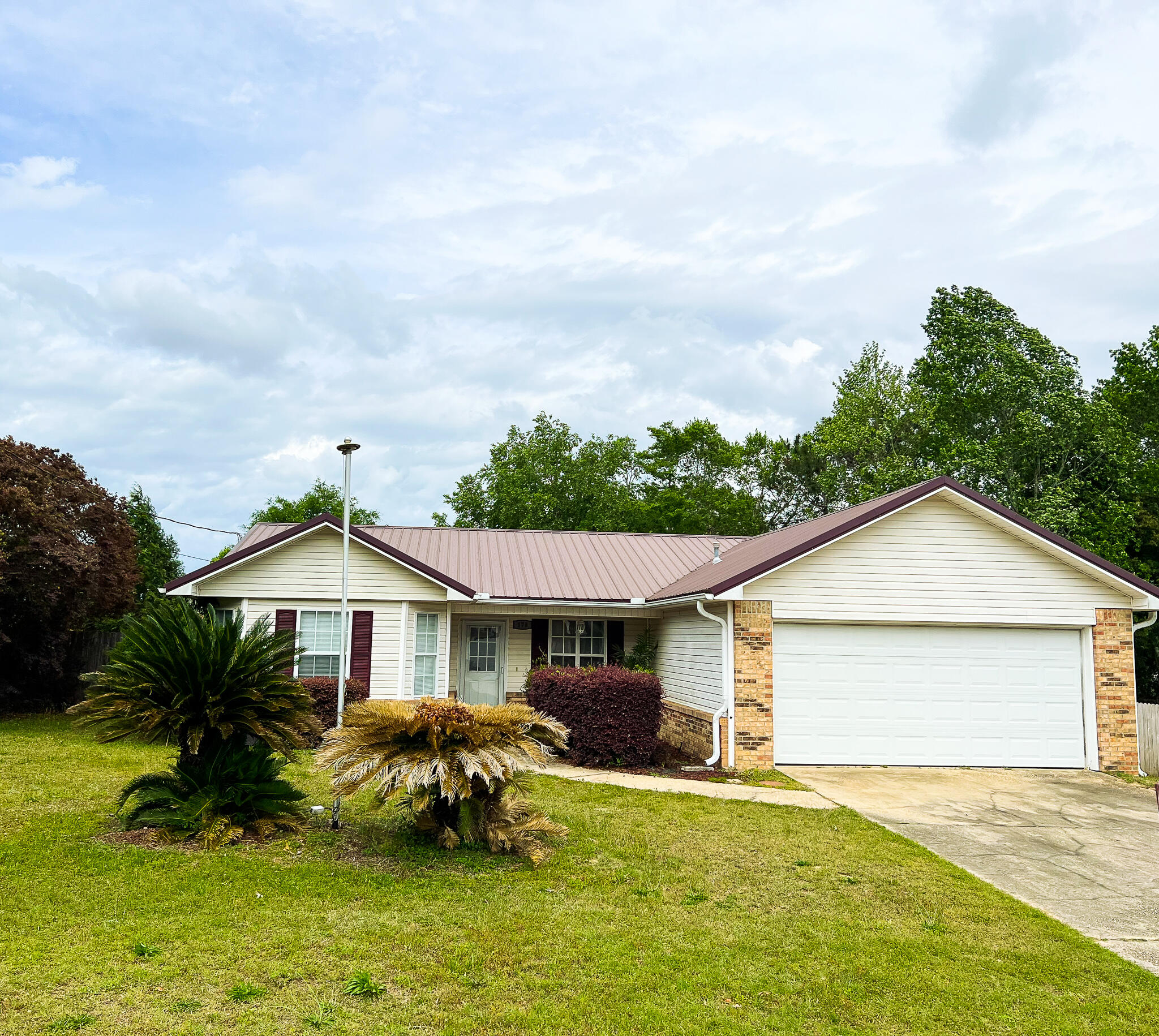 Location, Location, Location! This S. Crestview home would make a great investment property with its easy access to military bases. It features a split floorplan with 3 bedrooms and 2 bathrooms. Enter into the large living room that opens into the dining area and kitchen. The owner's suite is just off of the dining area and has a full walk-through bathroom that leads into the large walk-in closet. The other two bedrooms & bath are off of the living room on the opposite side of the home. Enjoy cookouts on the inviting back patio that overlooks the huge yard. Garage has been converted into 2 storage areas with closets. There is also a shower and utility sink in the garage. These items are not counted in the sqft. Most furniture will stay and has no value. Home & Shed are being Sold AS-IS