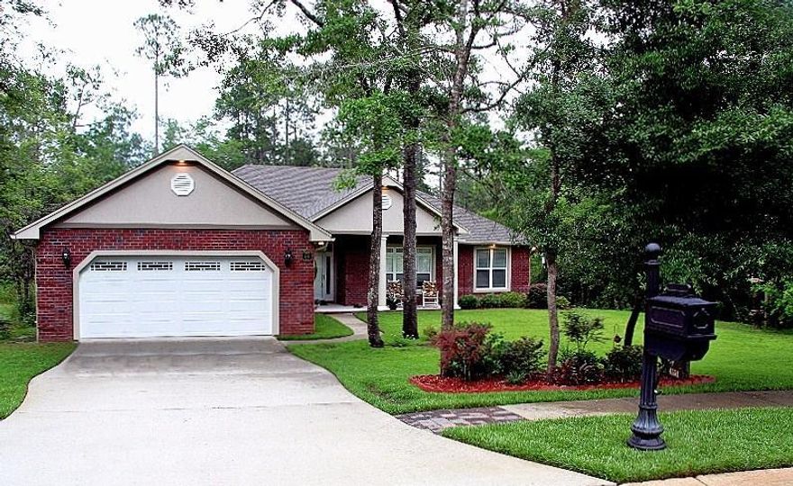 FIVE MINUTES NORTH OF DUKE FIELD. South Crestview brick home on a huge fenced in backyard, located towards the back of the neighborhood increasing privacy and decreasing through traffic. This home literally has it all and is located in THE HIGHLY SOUGHT-AFTER NEIGHBORHOOD OF JUNIPER CREEK ESTATES. Relax in this ultra-quiet neighborhood whichfeatures 100-year old oak trees. Juniper Creek is a secluded subdivision with well-maintained sidewalks, streetlights, and a community lake. It offers easy access to Duke Field, the 7 th SpecialForces Group and Eglin Air Force Base.This custom-built home features an open kitchen with custom made cabinetry, granite counter tops,large walk-in pantry, stainless appliances and a HUGE breakfast island overlooking the living andseparate dining The main living area features trey ceilings, crown molding and recessed lighting. Surround sound speakers throughout the house and one of the many wonderful upgrades you will enjoy! The master bedroom is situated behind the kitchen and nestled in the rear of the home. The master is large and can accommodate full-sized furniture. The en suite has a beautifully tiled walk-in shower, separate, soaking jet tub, granite top double-vanities and a spacious walk-in closet.

Bring the Dogs ! The screened porch with a natural gas outlet to hook up your grill is located off of the living room and offers an expansive view to the aluminum fenced back yard that backs up to protected woodlands and Juniper Creek. Privacy galore.! A custom-made swing compliments the large pergola deck lined with Edison bulb lighting. Perfect for sipping a lemonade as the sun sets. This home is situated on 0.65 acre lot that has been elevated to 8 feet above sea level.