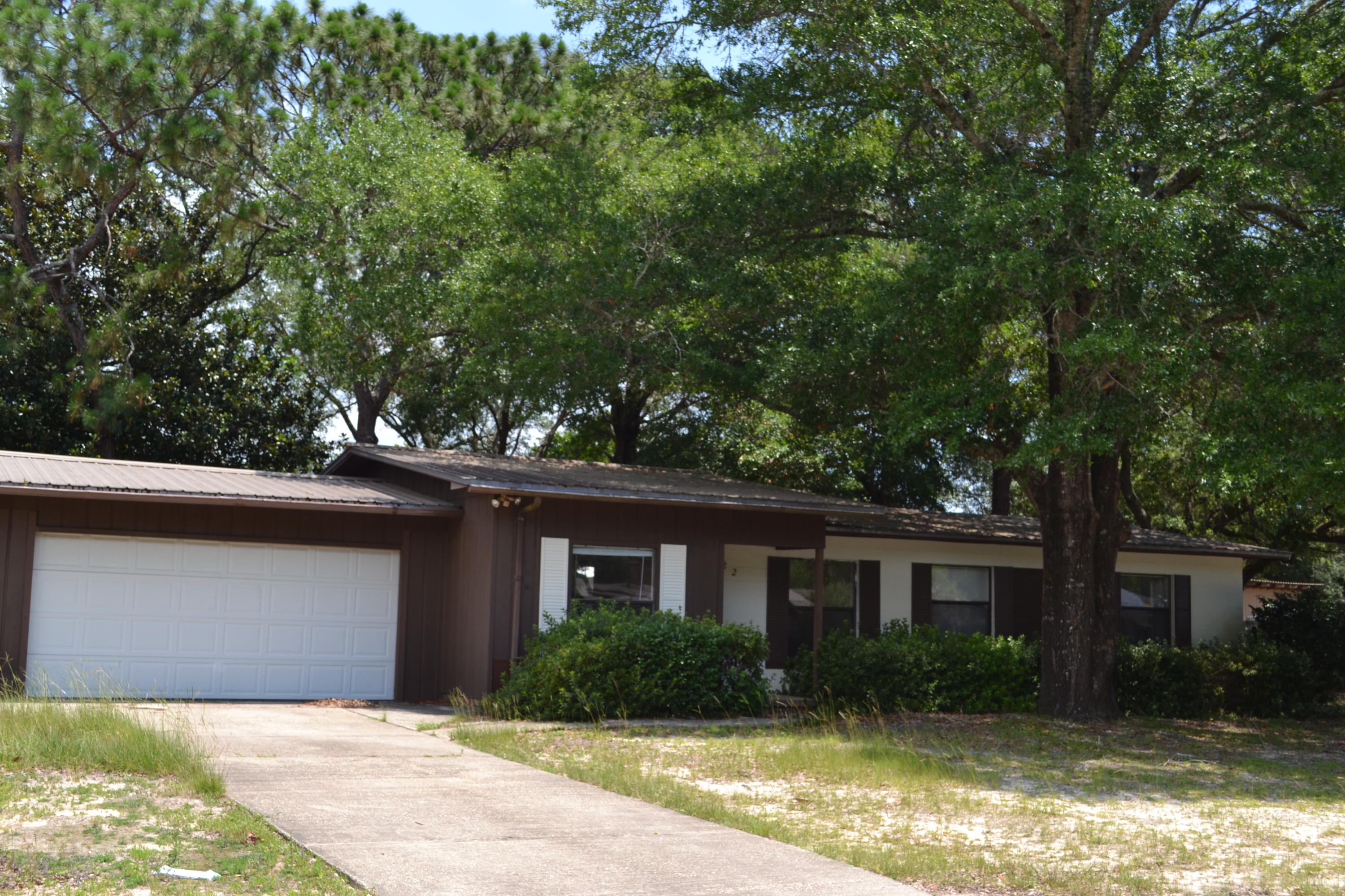 Charming, solid home in the heart of Niceville. Metal roof replaced approx. in 2005. Home is mostly renovated. It has a huge laundry room and separate closed in garage. Large, shaded backyard would be wonderful for entertaining. Back patio has a gas line, ready for your grill!