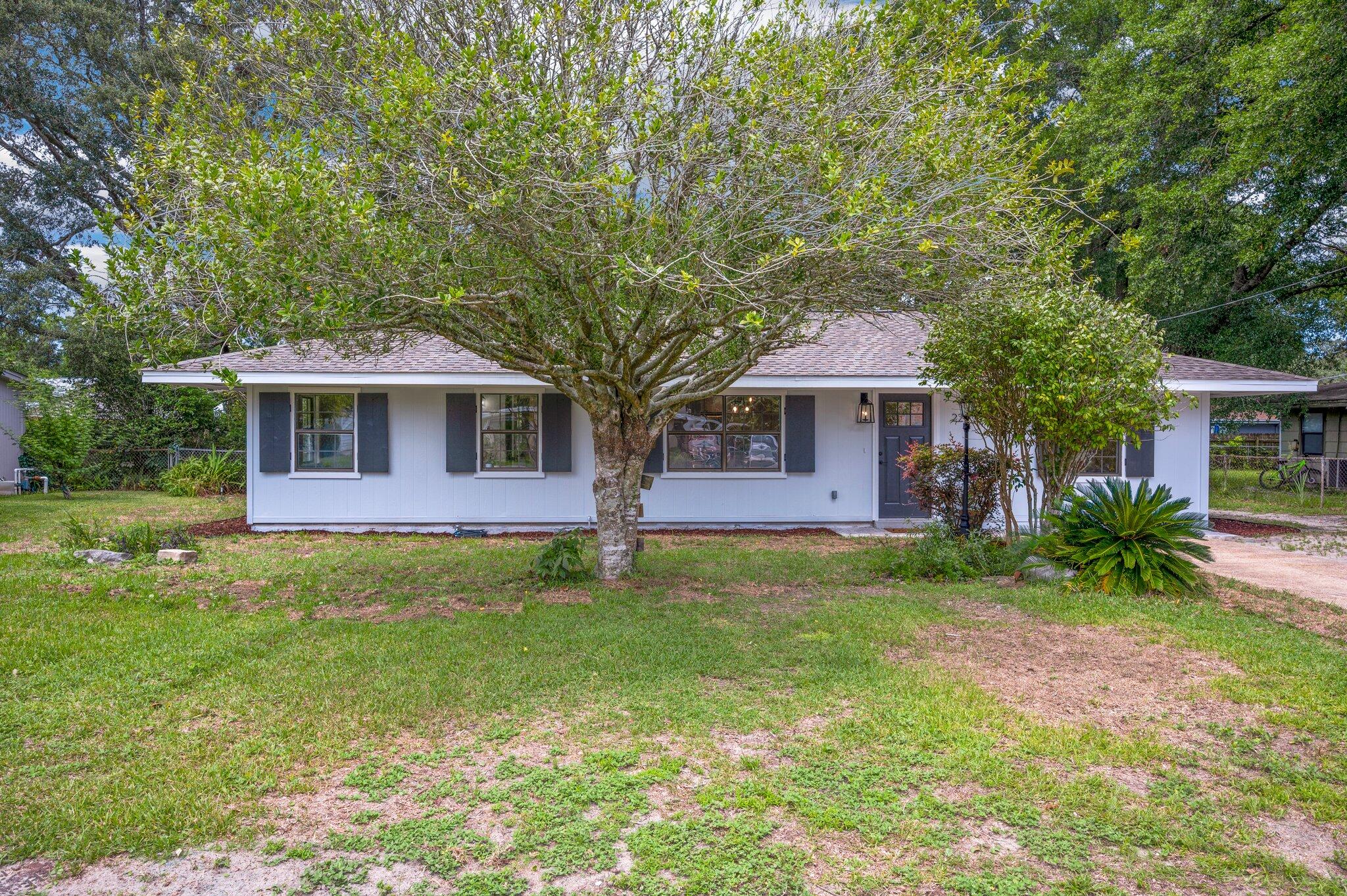 This completely renovated 1,630 sf home is absolutely charming from the moment you step onto the brick front porch. No detail has been overlooked with all new exterior and interior paint throughout, all new luxury vinyl plank flooring, all new fixtures and finishes and so much more. This home is completely move in ready. The open kitchen has all new stainless steal appliances including a gas range, real wood cabinets with soft close drawers, all new subway tile backsplash and granite countertops. The oversized stainless steel sink fitted with a removable bamboo cutting board looks out through the den and into the whimsical back yard. The master bedroom has its very own spa like master bath with a window style glass inclosed shower and double vanity. The second bath has all new tile on the walls and floor, new finishes, new vanity and light fixture. Rest easy knowing the roof was replaced in 2017, the hot water heater in 2019 and the the HVAC in 2018. All new gutters have been installed as well as all new exterior doors. No rental restrictions--short term rentals allowed.
There is a detached one car garage with plenty of room to park a vehicle and store your tools as well as two large storage sheds storage sheds on concrete foundations.
Located just 6 miles from Hurlburt Field, 1.5 miles from the white sandy beaches of Okaloosa Island and less than a mile from Downtown Fort Walton Beach, this home is perfectly located in the center of Fort Walton Beach.