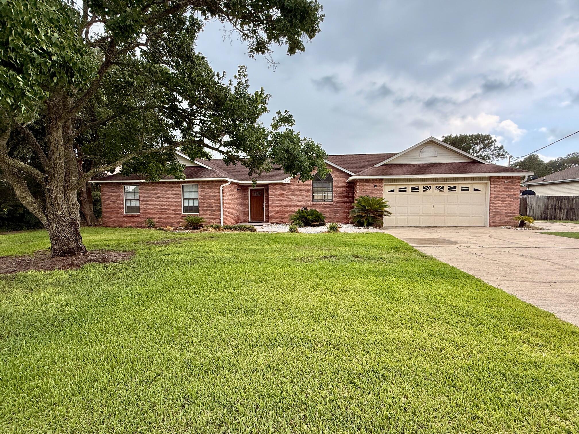 Spacious, Custom-Built 4-bedroom, 2.5-bathroom Home on a .46 Acre in Holley by the Sea! No carpet - all hard-surface flooring throughout! You'll find rich wood floors in the living and dining areas and durable tile in the rest of the home. A custom front door greets guests, and a convenient half bath is located just off the entry. Enjoy vaulted ceilings in the main living areas and the spacious primary suite, creating an open, airy feel. The great room features a cultured marble fireplace, while the adjoining dining area flows into a functional kitchen with beautiful wood cabinetry, a glass-top range, and a refrigerator with ice maker. The primary bedroom suite is generously sized, with a luxurious ensuite bath that includes a cultured marble Jacuzzi garden tub, separate shower, and dual vanities. Other highlights include an oversized garage with attic storage, an extra-wide driveway for added parking, and a tiled front walkway and rear patio that is perfect for outdoor relaxation. A 4-Point Inspection (Completed in Jan 2025) is available and notes that the Water Heater and HVAC were new in 2017 & the roof has at least 7 years of life remaining. Home is being sold AS-IS. This is a fantastic opportunity to customize this solid home in a wonderful location. Located in the highly sought-after Holly by the Sea, residents enjoy access to a wide range of amenities including indoor and outdoor swimming pools, a full gym, eight clay tennis courts, RV campsites, a beachfront event rental home, youth programs, a nearby boat launch, and more.