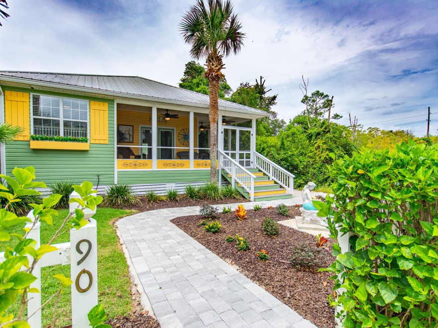 Make a lifetime of memories in this split-layout, five-bed, four-bath home positioned less than two blocks from private community beach access. Dubbed ''Mermaid Cay,'' this newly-renovated property offers a private pool and compound-style retreat with a main home and carriage house at the end of a quiet cul-de-sac bordered by nature preserve. Boasting $500,000 in renovations and Key West-themed decor, the main home offers three bedrooms and two baths and a spacious screened wraparound deck. The vaulted great room and open kitchen with built-in coffee bar are ideal for entertaining and comfortable living. The kitchen boasts stainless appliances including gas range and double ovens and granite countertops.