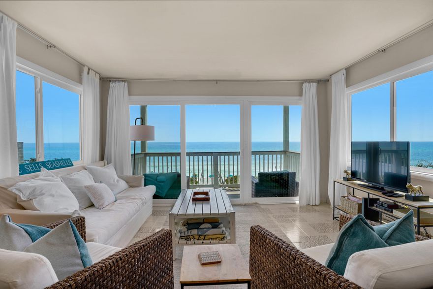 Offering incredible views, this one-bedroom gulf-front unit on 30A is a rare find. Enviably located in a small complex at the popular east end of 30A, it's close to Alys and Rosemary Beaches. The unit is surprisingly spacious with a sitting/dining room providing direct access to the sunny private balcony. Multi-aspect windows introduce plenty of natural light and deliver even more panoramic gulf views. The unit has a recently updated open kitchen with modern tile flooring, gray Shaker-style cabinets and butcher block countertops. It also has a laundry closet within the unit, complete with a washer and dryer. The bedroom has ample space for a range of furniture and a sofa bed can accommodate additional guests. The condo has direct access to the beautiful white sandy beach from a private