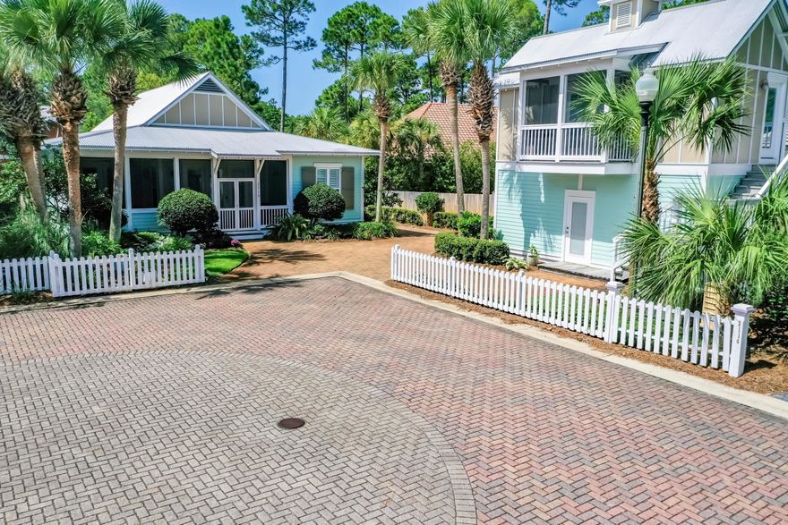 This charming and spacious Florida-style cottage sits at the end of a cul-de-sac in the ever popular neighborhood of Crystal Lake, located in the gated community of Sandestin Golf and Beach Resort. This home features a main house with the added advantage of a detached single car garage and upstairs carriage house. From the pavered driveway, with plenty of parking, you are greeted by a large screened-in front porch, made for relaxing mornings and tranquil evenings, spent with family and friends. Upon entering the single-level main house, the soft coastal tones convey a light, airy feeling that is carried into the dining and kitchen areas, with beautiful travertine flooring and crown molding. The spacious master features an en-suite bath with a double vanity, soaking tub,