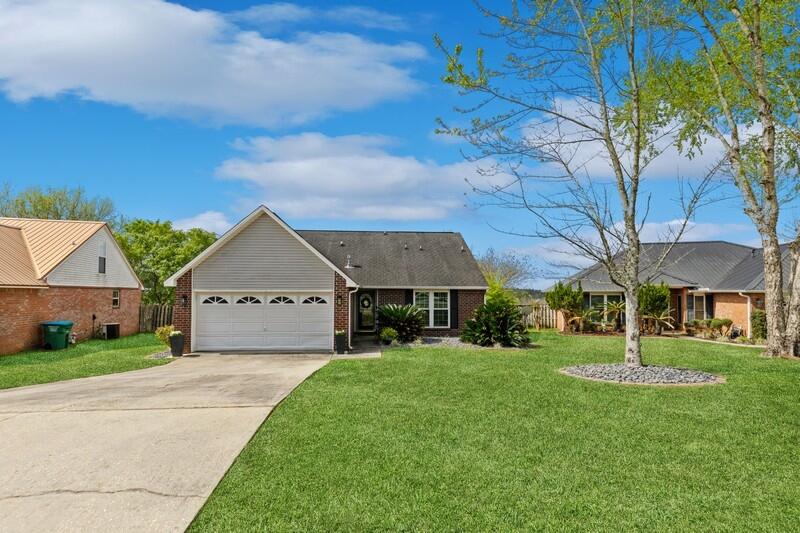 OPEN HOUSE April 8th from 12-2 pm!! You don't want to miss this wonderful new listing in South Crestview! The home has 4 bedrooms, 3 bathrooms, a very large living room, an eat-in kitchen + a dining room. It's been beautifully remodeled and offers a cozy space to come home and relax. Some updates to the home include an updated back deck, brand new windows throughout and a sliding back door, new flooring, HVAC 2019, fresh paint throughout, a brand new fan with remote in the master bedroom, an updated fireplace, all-new rock in the landscaping, new smoke detectors, new lighting fixtures in the dining room, bathroom, kitchen, closet, and the backyard is fully fenced and MASSIVE, it sits on nearly half an acre and has a gorgeous view from the large back deck and is great for entertaining. The seller will provide a brand-new roof & hot water heater with an acceptable offer. Call to schedule your showing today!
