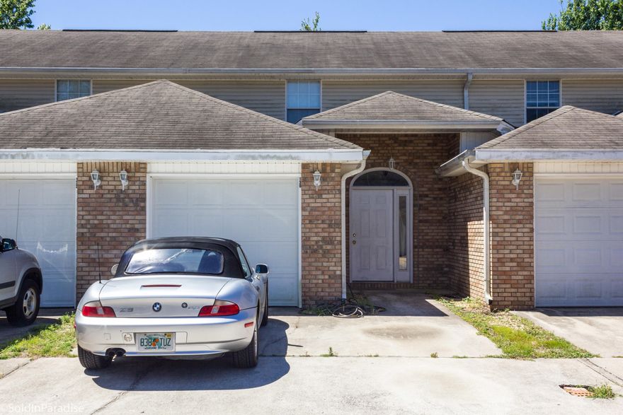 This lovely 2 story townhome is located in a quiet neighborhood in Mary Esther. The living, kitchen, and dining areas are open and flowing. The main living space was updated with vinyl tile flooring in 2015. Glass sliders lead you to the private fenced in deck and yard. Each of the two bedrooms feature their own bathroom and ample closet space. The laundry and half bath are located off the entry hallway. A one car garage provides additional storage or parking. Just minutes from beaches, shopping, schools, and only 6 miles from Hurlburt Field makes this a prime location. This unit has been well-maintained by the owner and is currently a rental unit. Buyer to verify all dimensions.