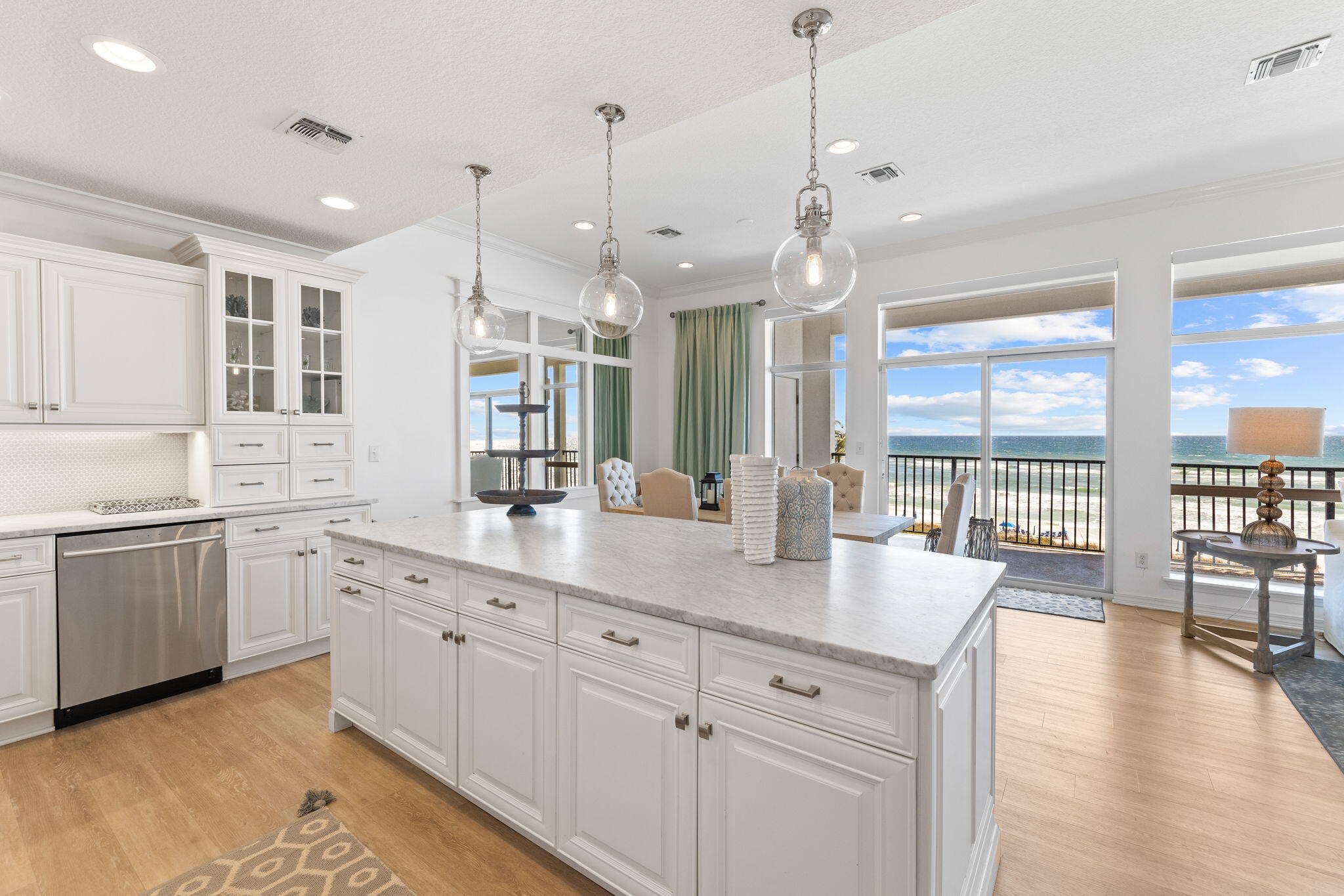 Welcome to an exquisite gulf-front offering on the western end of 30A! Located inside a wonderful gated beachfront development, Unit 306 has been beautifully designed with an extensive & luxurious renovation. This three bedroom, top floor condominium showcases panoramic views of the Emerald Coast. The kitchen is sure to impress with its custom cabinetry, large island, stainless steel appliances & marble countertops. The large island in the kitchen is the perfect gathering space with bar seating for four & plenty of storage. The dining area is unforgettable with its delightful view & comfortably seating six. The living room has been tastefully designed and is the best space to unwind after a long beach day while soaking in a marvelous Gulf view.