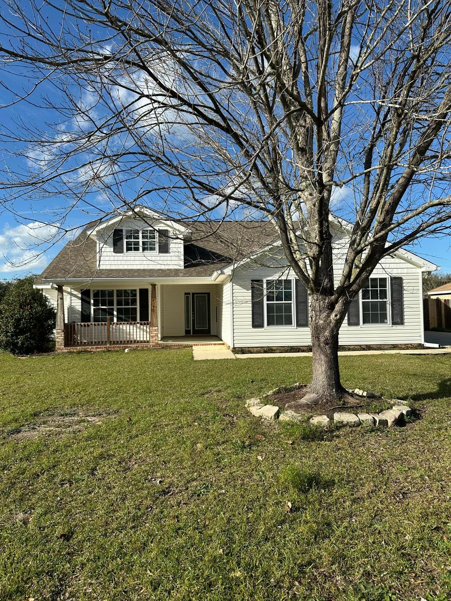 This beautiful light, bright and spacious ranch style home is a 3 bedroom, 2 bath plus office/4th bedroom property located in this small neighborhood in the heart of Pace.  It's freshly painted throughout offering new carpet, new stainless steel stove, microwave, dishwasher and a new washer and dryer.   The extra long driveway leads to a fence gate for extra back yard parking and the two car garage offers enclosed parking. The new backyard deck is perfect for potted plants, dining, outdoor relaxation or entertaining. Conveniently minutes from top-rated schools, shopping, local amenities, medical facilities and the new Walmart that is under construction down the street. This home blends relaxation  with an extra large backyard for playing and its ideal prime location.