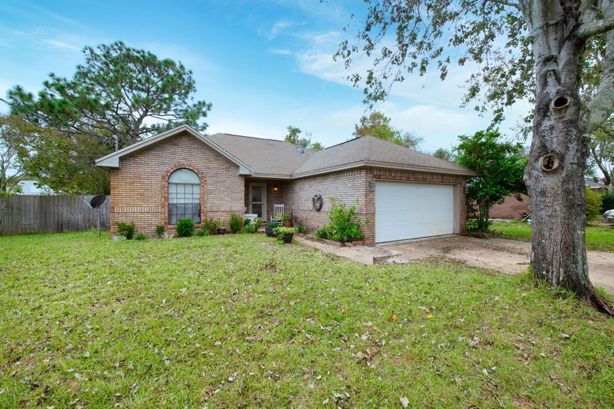 New to the Navarre marketplace is this 4 bed 2 bathroom, all brick spacious home. Located in the heart of Navarre, directly behind the Walmart and less than 10 minutes from Navarre Beach! No more worries during power outages, because this home comes with a whole home generator. As you walk in, you'll be greeted by beautiful floors, a spacious living room with vaulted ceilings, a gas fireplace, and a room filled by natural light. The home comes with a gourmet kitchen, ceramic tile floors and granite counters within, complimented by stainless appliances. The master suite also has vaulted ceilings, with a very high class master suite bathroom. Great for families that require more bedrooms, as you'll enjoy 3 guest rooms throughout. A large wooden deck feature, and fully fenced yard complete the home as the perfect full package for the incoming family. Whether your commute is to Hurlburt, or Eglin, you'll enjoy being just off Highway 98, without ever having to hear the motorway. Prytania circle is very set back, nestled with privacy. It is perfect for dog walks, bike riding, or evening strolls. Call for a private showing today. 