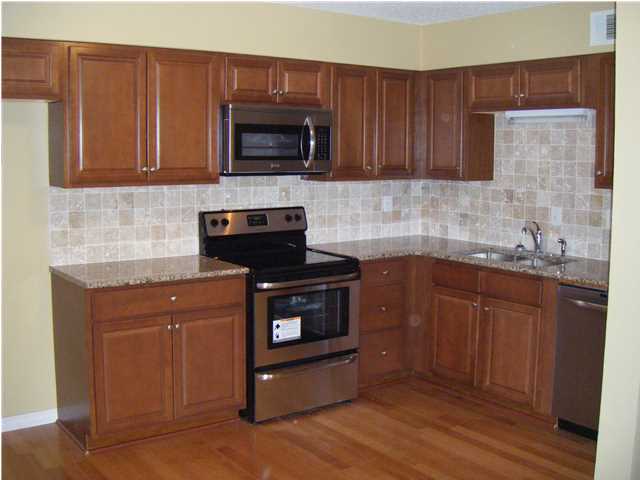 Bay front living on Choctawhatchee Bay in Destin, FL ! Enjoy the water, the outdoors in your 3 bedroom, 2 bath townhome now offered at an exceptional price. Move in tomorrow... Recent renovations include new wood flooring on first level (living room, family room, dining area and kitchen), granite, new cabinets and appliances in kitchen, new carpet on the stairs and all 3 bedrooms, and new granite vanity tops, fixtures and reglazed bathrooms...Spectacular views and lovely grounds with old oak trees draped by Spanish moss with a large pool, tennis courts, picnic area with grill, along with boat ramp and dock. Not a short sale, not bank owned. Short term rentals not allowed in Mossey Cove. Easy show !!!