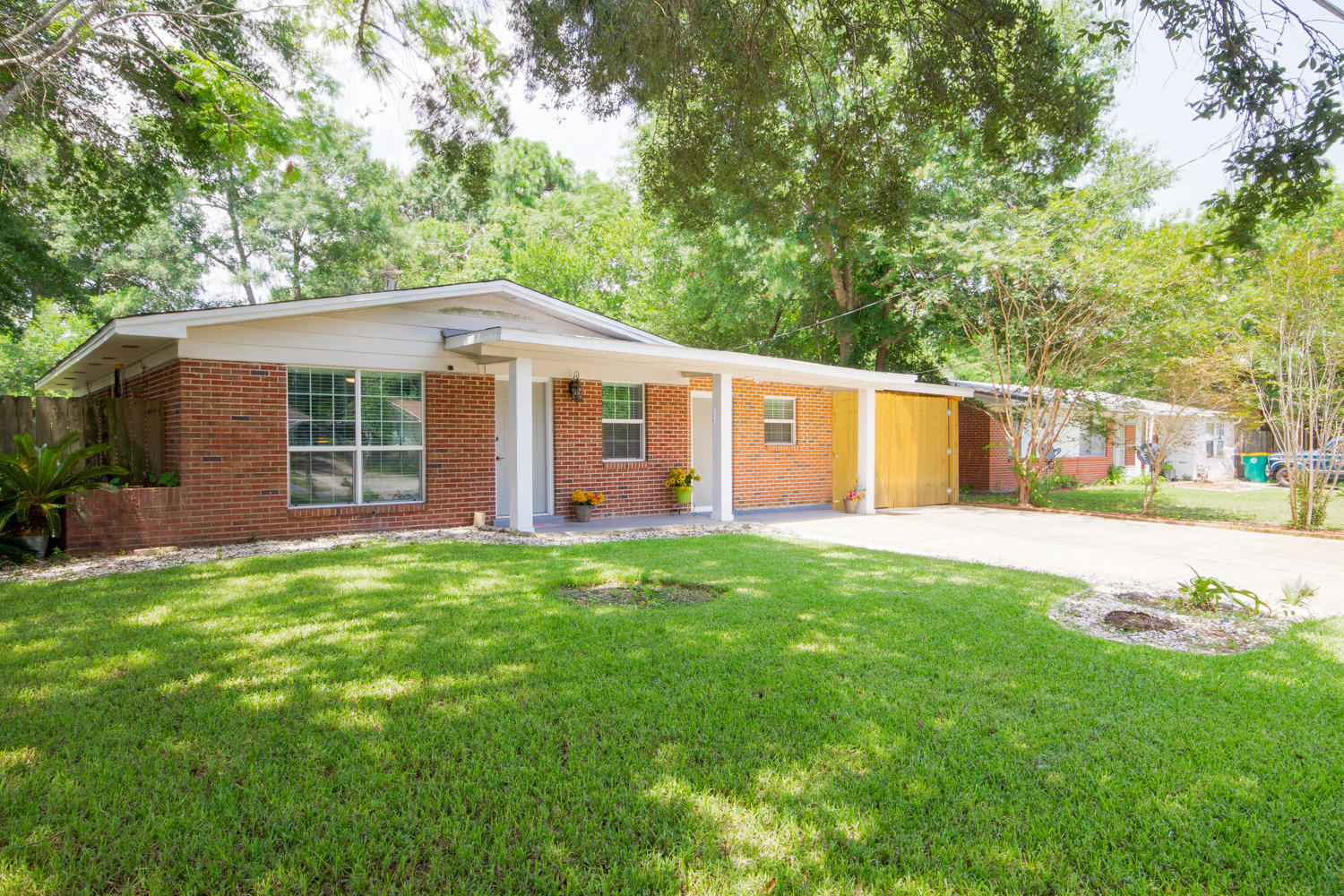 This is your chance to own a renovated solid brick home in the heart of Fort Walton Beach on a large almost 1/4 acre lot with a huge workshop in the back for a great price!This adorable 3/2 features a great carport that you can fully closed & locked for the protection of your special vehicle, small boat or motorcycle. Plus you can drive right through the carport to the backyard where you have a huge fully fenced backyard and large 16x12 workshop.The inside features beautiful new tile in the living spaces and engineered wood laminate in the bedrooms. A Brand new kitchen with new cabinets, granite and new charcoal stainless steel appliances. Plus there is a nice built in office desk with cabinetry & granite top that overlooks the front yard. Nice sized dining room nook just off the