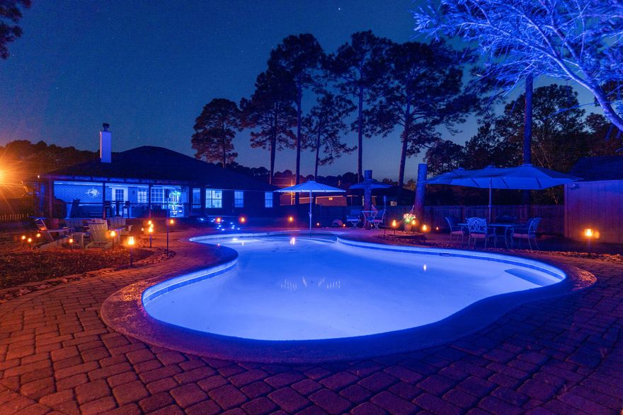 This isn't just a home--it's a vibe. With just over 3,000 square feet of sun-soaked, coastal chic living space, this 5-bedroom, 3-bath beauty is packed with style, space, and standout features made for making memories.Inside, you'll love the polished white tile flooring, open layout, and bright, beachy feel throughout. The spacious eat-in kitchen with bar seating flows effortlessly into the main living area, and the formal dining room doubles perfectly as a home office or flex space. A sunroom adds even more room to relax and enjoy.Now let's talk entertaining goals--because the backyard is next-level.Unwind in your screened-in patio, modern ceiling fan, and hot tub--perfect for game days or laid-back evenings. Step outside to your private retreat featuring a gunite saltwater pool, expansive multi-level pool deck, and a custom fire pit area surrounded by built-in benches and ambient lighting. It's the ultimate setup for weekend BBQs, birthday parties, or spontaneous sunset swims.

Need extra space? There's a large 16x16 workshop/shed for all your tools, toys, or creative projects.

Tucked away on a peaceful street in sought-after HBTS, this home blends upscale comfort with relaxed coastal living. Whether you're hosting the whole crew or soaking up a solo Sunday, this home is built to impressand made to enjoy.