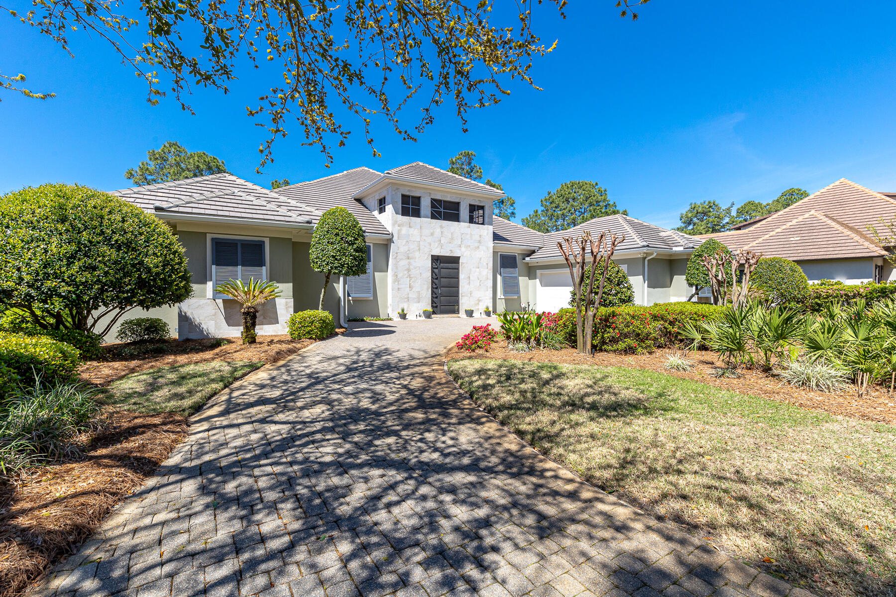 PRICE REDUCE! Seller is found another home. Nestled in the heart of Sandestin Golf & Beach Resort's esteemed Island Green. This home stands as a masterpiece of contemporary elegance, offering a coveted lakefront position with breathtaking views over the 5th hole of the Raven golf course.Upon entering, the home unfolds into a grand lanai, the epicenter of outdoor living, featuring a heated pool and hot tub, perfectly crafted for both serene relaxation and lavish entertaining. Unique to this property is a private carriage house, complete with a spacious bedroom, bath, morning kitchen, and its own garage. New Washer/Dryer, Wine Cooler, 4 New TV's, 2 New Dishwashers, New pool Heater/Filter, 3 Newer HVACs. New Gas Stove Top ,New Refrigerator/guest house. New Sound System.