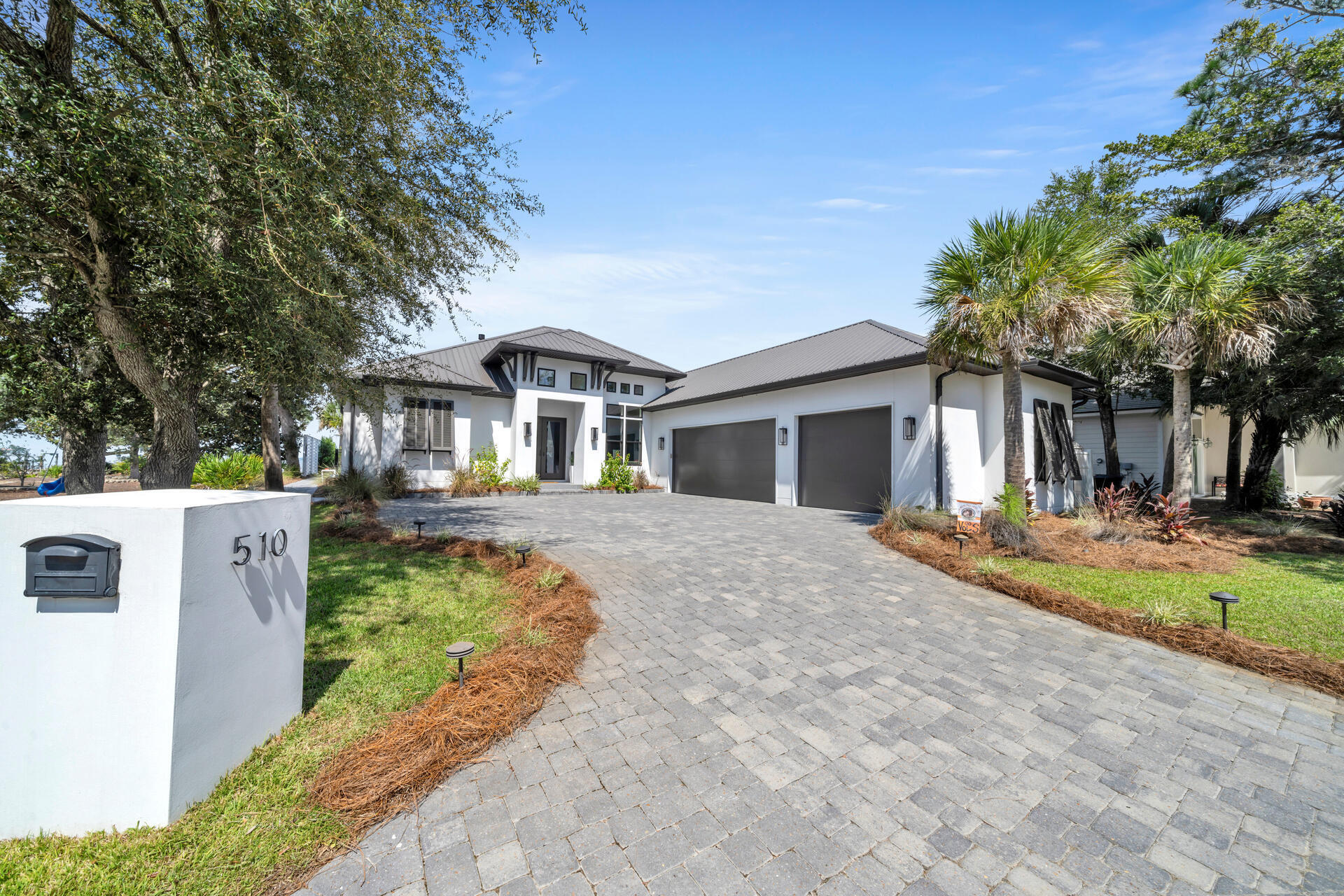 Beautiful custom built home ON THE BAY! This stunning home has it's own private and covered boat dock with a lift! Inside boasts an open floor plan perfect for entertaining with large windows, tons of natural light, and breathtaking views of the bay! A large primary en suite with tile shower, double vanity, free standing soaking tub, large walk-in closets, and access to the incredible back yard where you can enjoy the beautiful sunsets! Four bedrooms all with bay views AND a home office, large kitchen island with seating, large dining area, bar, and a three car side entry garage. PERFECT location just minutes from the beach, shopping, dining and a short boat ride to some of Destin's favorites like Baytowne Wharf, Northbeach Social, and Lulu's! Welcome Home!