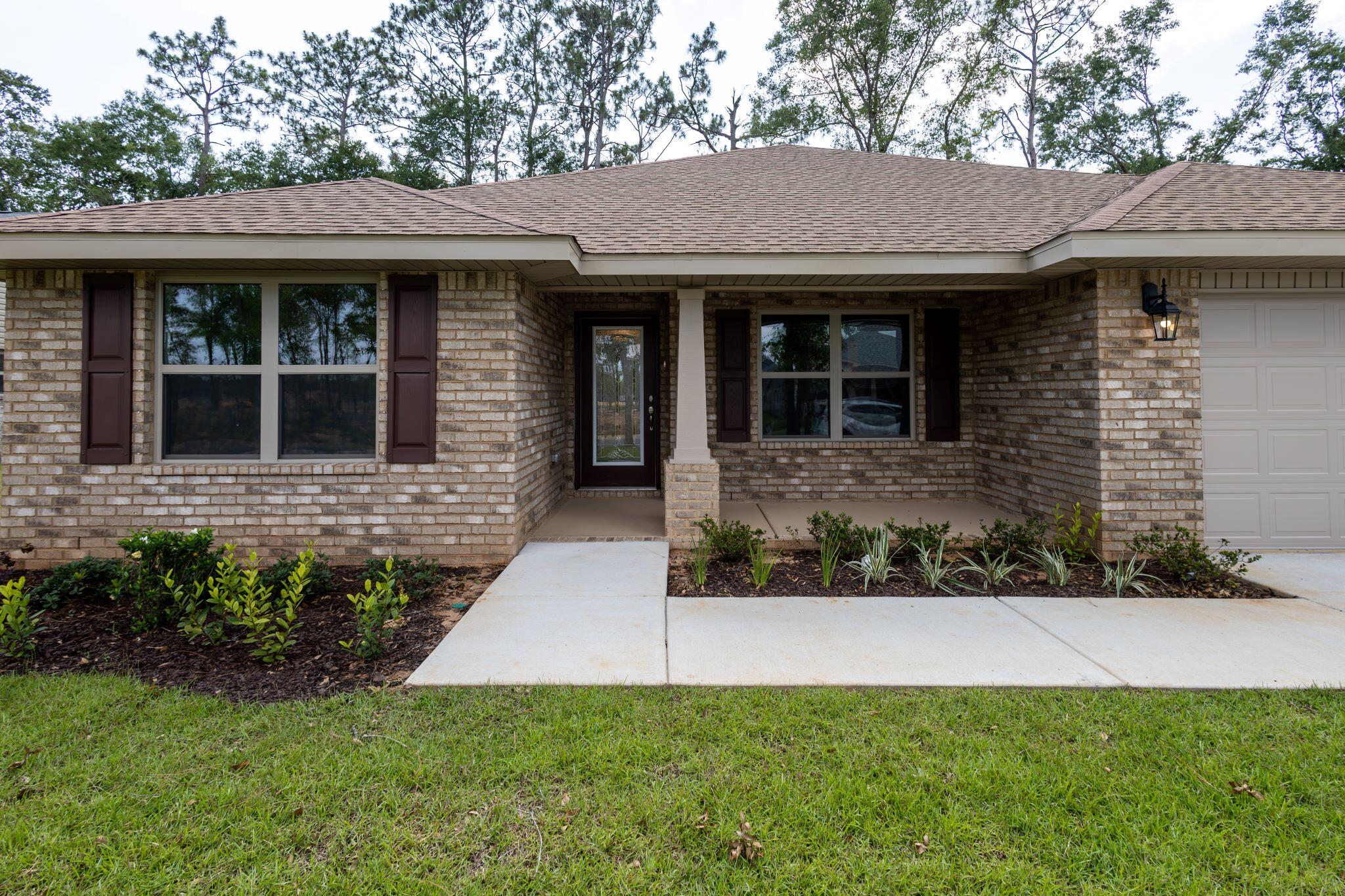 This home has 4 bedrooms and 2 full bathrooms in a split floorplan. The master has its own en suite with a walk in closet, dual vanities and a separate shower with garden tub. The kitchen has a centrally located island and a formal dining room. The floors have been upgraded with LVP and bedrooms are carpeted. The kitchen and bathrooms have granite countertops. The patio in back has been upgraded to a 14' x 16' covered porch. The home is 4 sided brick and comes with sprinklers. The family room has a cathedral ceiling with fan. The home is situated at the beginning of a cul de sac and this subdivision is well lit. Come see your new home!