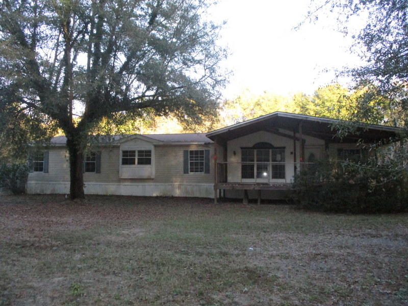 This HUD REO home rests in the a country setting on 6 acres. Built in 1992, this 4 bedroom 2 bath mobile home rests on a mostly wooded lot and comes with large porch, privacy fenced area and an in ground pool. Home needs repairs and will not qualify for most financing. HUD properties are a great way to purchase homes and this is a great opportunity. Call today! Property is FHA (IE) Insurable with Escrows.