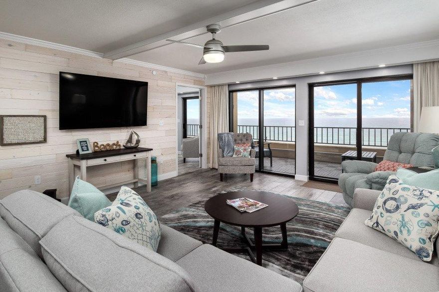 This gorgeous Gulf-front condo is the most spectacularly renovated 2-bedroom 2-bath unit I've ever seen! Not only that, Surf Dweller boasts some of the most spacious 2/2's on Okaloosa Island, at 1453 square feet. This renovation opens up the entire kitchen, creating one large great room where the open kitchen and dining areas combine, then flow directly into the living area and out onto the Gulf front balcony. The shiplap all along the east wall lends the feel of an elegant beach getaway. The view from the 6th floor will take your breath away!

The large kitchen island is a beautiful quartz, with 6 counter-height chairs on three sides. Custom cabinetry under the island and all along the west wall provides more than enough storage for all your needs, (keep reading!) as well as under-cabinet task lighting. All-stainless appliances are new in 2020 and include an extra-large beverage refrigerator for wine, beer and sodas, freeing up space in the refrigerator. (Tip: The vodka goes in the freezer!). A 4-seat dining table adds even more seating, so invite all your family and friends!

The living area offers comfy couches and chairs, wonderful for socializing, watching the wall-mounted TV or the Gulf from inside when it rains. Naturally, you'll spend more time enjoying the Gulf from the spacious 30-foot balcony, fitted with durable poly-wood slotted tiles that allow sand and rain fall through. 

The bedrooms are some of the largest around, and the master provides expansive Gulf views of its own through two full sliding glass doors opening directly to the balcony. The master bath features quartz counters, dual sinks with a vanity between, a fresh wavy blue and green backsplash and the coolest touch-light mirrors EVER! The second bedroom offers two queen beds, a sitting area and a view of the Sound. The second bath is appointed similarly to the master, with dual sinks, quartz counters, fun backsplash and touch-light mirrors. Both baths have oversized showers. 

Surf Dweller provides several amenities to its owners and guests, including swimming and wading pools, tennis court, fitness center, covered picnic pavilion and barbeque grills. And of course, beach service! There is plenty of open parking, and a few first-come first-served covered spots.  

Other details include all-LED lighting for energy efficiency, remote controls for the ceiling fans, and multiple lockable owner closets. The AC is 7 years old, water heater is 11, and the dehumidifier that keeps the unit fresh and dry conveys. There are screens for the sliding glass doors stored under the bed in the master. 

Don't wait, this is such a lovely and unique condo, it won't last long! Easy show, schedule your visit today!
