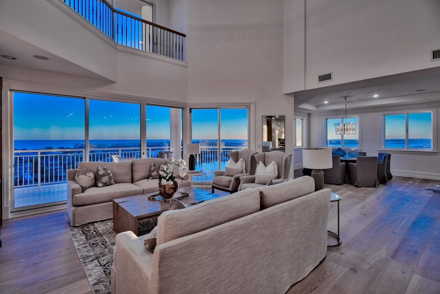Stunningly and completely renovated top-floor penthouse with a 70-ft boat slip in Grand Harbor, Destin's exclusive condominium community with 500 ft of private waterfront and deluxe amenities. This west-end corner unit occupies the most desirable location in the building, offering complete privacy and an incomparable vantage of the Gulf of Mexico, the Harbor, and the Destin Bridge. Every inch of this 4,800-sqft redesign by acclaimed Swift Construction was carefully considered. The warm white designer kitchen with quartz countertops, rustic wood base cabinets, and metallic backsplash is light, bright, and classic. All baths are stylish and serene with high-end tiles and fixtures. New hardwoods throughout accent a strikingly reconfigured stairway.