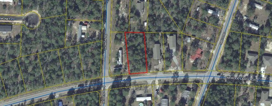 Lightly wooded lot on a paved road just outside of City Limits of DeFuniak Springs. Public water is available. Perfect for a new home.