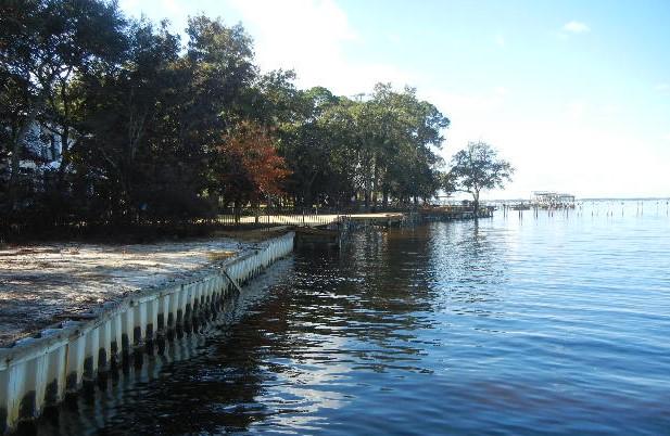 Enjoy the beautiful sunsets with 90 feet of water frontage on the Choctawhatchee Bay in the Driftwood Estates. This deep lot is almost a full acre and has a vinyl sea wall in place.