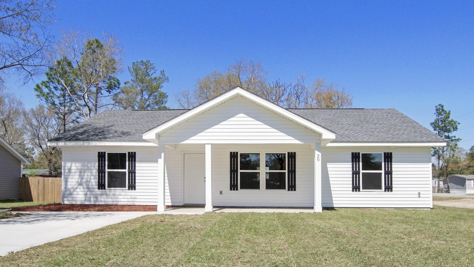 Beautifully crafted NEW home, built with top-notch quality and care. This modern design features an open-concept layout with vaulted ceilings, 3 bedrooms, 2 baths, LVP flooring in common areas, white shaker cabinets, quartz countertops, and stainless-steel appliances -- and yes, the refrigerator is included! Enjoy a covered back porch for relaxing or entertaining. Go under contract by August 31st to personalize select finishes, and best of all, the builder covers closing costs! Ideally located in charming DeFuniak Springs--just 45 minutes from the beaches of South Walton, 20 miles from Crestview, 30 miles from Eglin AFB, and 45 miles from Hurlburt Field. Photos are of a prior build with the same layout. Finishes will vary.