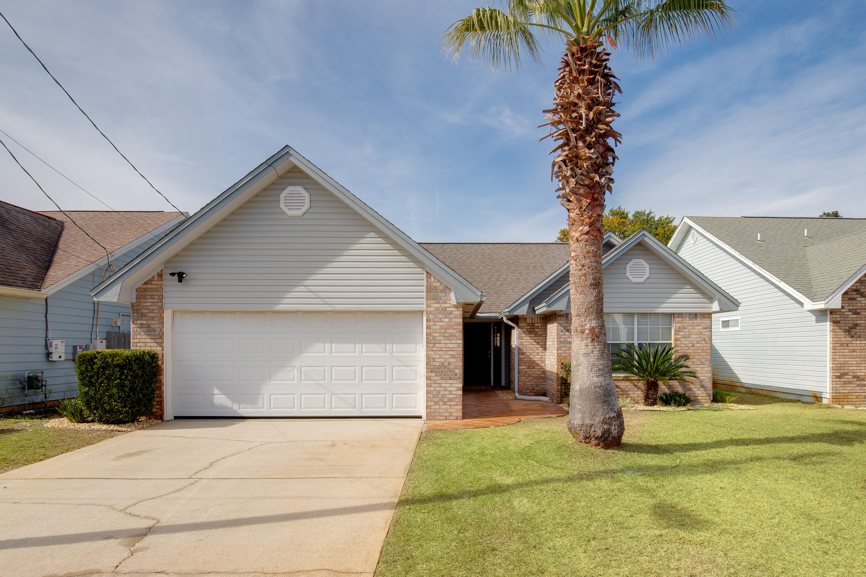 Welcome to 433 Sandy Ridge Circle, a beautifully maintained 3BR/2BA home in the quiet, no-HOA community of Sandy Ridge Estates. A brand-new roof will be installed before closing, giving peace of mind for years to come! Inside, enjoy an open, sun-filled living room with vaulted ceilings, a cozy fireplace, and stylish flooring. The kitchen features ample cabinet space, modern appliances, and a breakfast bar. The spacious primary suite offers a walk-in closet and private bath. Outside, the fenced backyard and patio are perfect for entertaining or play. Just minutes to Hurlburt Field, top-rated schools, shopping, dining, and the white-sand beaches of the Emerald Coast--this move-in ready home blends comfort, charm, and convenience. Schedule your showing today!