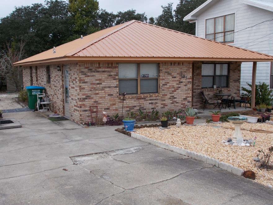 : Wonderful BRICK Home with Metal Roof Only a short walk to Laguna Beach (At Walkway 84) This would be a great Primary ,Second Home or Rental Property . This Great Beach Cottage has it All .Great Storage out back for all Your Beach Toys .