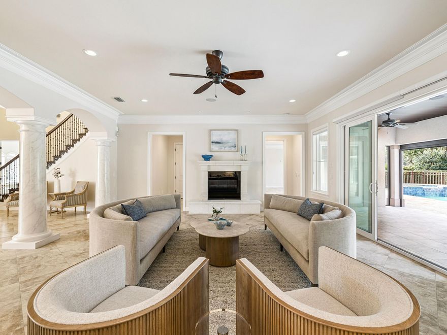 Positioned within a gated setting known for distinction and privacy, this custom-built Mediterranean-style estate offers a rare combination of architectural presence, thoughtful design, and extensive modern upgrades. Built in 2016 on a large private lot overlooking championship fairways, the residence spans approximately 6,438 heated and cooled square feet and delivers both scale and substance in equal measure. The two-story floor plan is intentionally designed for refined entertaining and comfortable everyday living. Formal living and dining rooms anchor the main level, complemented by a generous breakfast room and an inviting den. The gourmet kitchen serves as the heart of the home and is equipped with an impressive suite of Sub-Zero, Wolf, and Bosch appliances, a walk-in pantry, and abundant storage. Rich heartwood cabinetry, solid-surface flooring, and carefully selected architectural details create a timeless interior aesthetic throughout. The first-floor primary suite is a true retreat, featuring separate his-and-her bathrooms, expansive dual closets, and an attached private study. Additional guest accommodations are thoughtfully arranged, including a suite that also functions as a pool bath. An in-home elevator provides convenient access between levels, enhancing ease of living and long-term comfort. Upstairs, the home continues to impress with a dedicated home theater room with risers and sound, along with a finished storage or flex space featuring custom wood shelving. Storage is a standout feature, with a reinforced attic accessible via a cargo lift from the spacious three-car garage, allowing for effortless organization without sacrificing living space. Recent improvements and upgrades further elevate the property and reflect meticulous ownership. Enhancements include a Sentricon termite prevention system, rust-prevention irrigation system, seamless gutters with gutter guards, a whole-house water softener, upgraded outdoor lighting at both the front and rear of the home, and a fully fenced backyard. The pool has been refreshed with a new pump and lighting, while a dedicated well supports lawn irrigation for lush, consistent landscaping. Additional upgrades include a whole-house generator, energy-efficient construction with open-cell foam insulation, multiple high-efficiency heat pumps with UV purification systems, and extensive surround sound throughout the home, including outdoor areas and the garage. Outdoor living is anchored by a heated pool and spa surrounded by beautifully landscaped grounds, offering privacy and a tranquil, park-like backdrop along the golf course. This exceptional residence pairs classic Mediterranean architecture with modern systems, abundant storage, and thoughtful enhancements, creating a home of enduring quality and understated luxury.