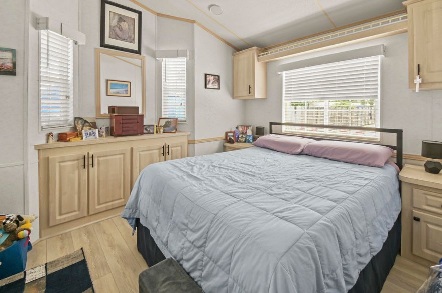 Experience beachside living in this meticulously cared for open planned home less than 2 blocks from the beach in a private gated community and steps away from community pool and clubhouse. This unique Chariot park model home is 14 feet wide (the widest in Destin Village) with vaulted ceilings and crown molding creating a large inviting common area that is open and airy while at the same time providing plenty of storage. New LVP flooring, lighting and ceiling fans have been recently installed, upgrading the interior decor for a modern feel. All appliances are less than 5 years old to include the side-by-side refrigerator and the full-size gas stove. Outside there is a large 8X10 storage shed that can be converted to a bunk room and parking for 2 vehicles. Enjoy a beverage after spending the day at the beach and enjoy the cool sea breeze outside in the 14.5-foot screened patio. Alternatively soak in the warmth of the sun on the uncovered 16-foot deck. This park model home would make a lucrative short-term rental due to its proximity to the Gulf's public beaches, community amenities and the restaurants & shopping in the area. Don't miss out on this fantastic opportunity, schedule your appointment today.