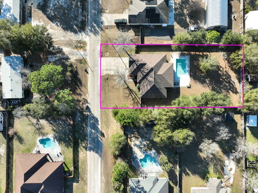 Step into this BEAUTIFUL CRAFTSMAN style home, perfectly located off Hwy 98, Hwy 87, and just a few miles from the SUGAR-WHITE sands of NAVARRE BEACH! This home is a DREAM come true for those seeking their own slice of the FLORIDA paradise with NO HOA and a SPACIOUS 1/2-ACRE lot - plenty of room to fit the BOAT and RV! Your own PRIVATE OASIS awaits with a covered 18 X 10 PORCH, saltwater SPARKLING GUNITE POOL with bubbler SUNDECK, and a large open PATIO! Entertain with EASE - there is a FULL BATHROOM accessible from the patio! Inside there is a WELCOMING foyer leading to the GREAT room, w/ HIGH 10' CEILINGS THROUGHOUT! All 4 bdrms are good sized, as is the optional OFFICE/5th bdrm. This home has the SPACE that you need, with the OPEN living, SPLIT-FLOORPLAN layout that you are looking for!