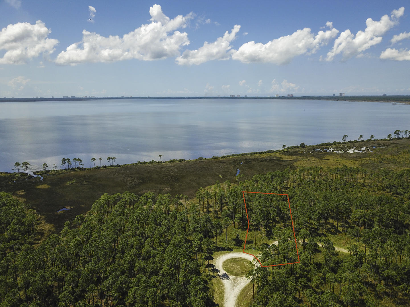 This is the perfect opportunity to build your dream home! Rivercamps is a quaint neighborhood nestled between the Intracoastal Waterway, Crooked Creek and West Bay. This gated community has so much to offer. Linked by extensive trails and boardwalks, the RiverCamps community offers outstanding amenities such as the RiverHouse swimming pool, grill and pavilion, fitness center and a boat ramp on the Intracoastal that leads to the Gulf of Mexico.