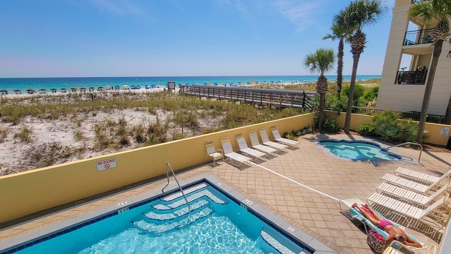 DIRECT GULF VIEWS from this 1st floor (with ''2nd floor views'' because of the parking garage underneath!) condo at the beautiful Pelican Isle Condominiums! Unit makes for a primary residence, great second home or vacation rental, with a steady stream of rental revenue. Inside, you'll find a FULLY FURNISHED - READY TO RENT - condo complete with full kitchen w/ breakfast bar, stainless steel appliances, and quartz countertops, open living/dining area w/gorgeous gulf views from your covered balcony with resort style low maintenance Polywood Patio Furniture. Condo sleeps 6 w/ hallway bunks w/flat screen TV's for the kids, cozy queen sleeper w/8'' inner spring mattress.  HVAC was installed in 2020 & water heater in 2022. Pelican Isle has many amenities that makes this a real treasure on the island including waterfront pool & hot tub community & exercise room, beach chair & umbrella service, shower & beach
walkover.  Enjoy the island's new "Beachside" restaurant/bar close to the complex with indoor/outside seating while enjoying the sound of the waves.  There are plenty of restaurants, live music, fishing & shopping on the island to enjoy.   