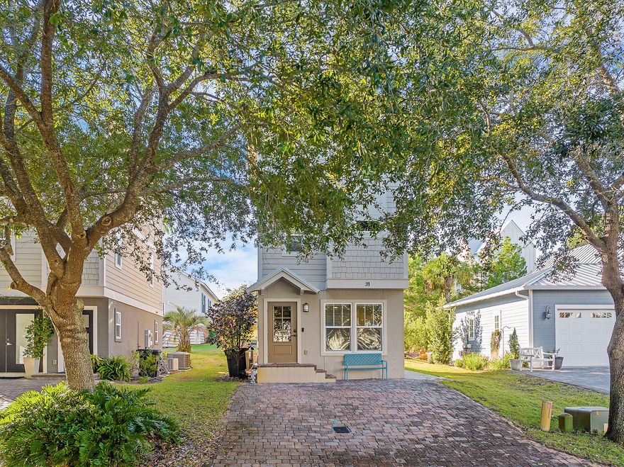 Price improvement! Come and get it this slice of paradise!Indulge yourself in the 30A lifestyle with this residence located just half a mile from the quiet and in-demand Blue Mountain Beach. Tucked away on a serene dead-end lane, this home has been meticulously maintained and provides its owner with privacy and many amenities that set the tone for an unparalleled 30A living experience.  Step through the main entrance into a bright, open living area spanning three stories. Modern wood flooring transitions seamlessly into tile in the kitchen, where a peninsula bar, beneath chic pendant lights, defines the space for casual dining. Admire the sleek quartz countertops, modern cabinets, and stainless steel appliances that grace the kitchen, creating a haven for culinary enthusiasts.