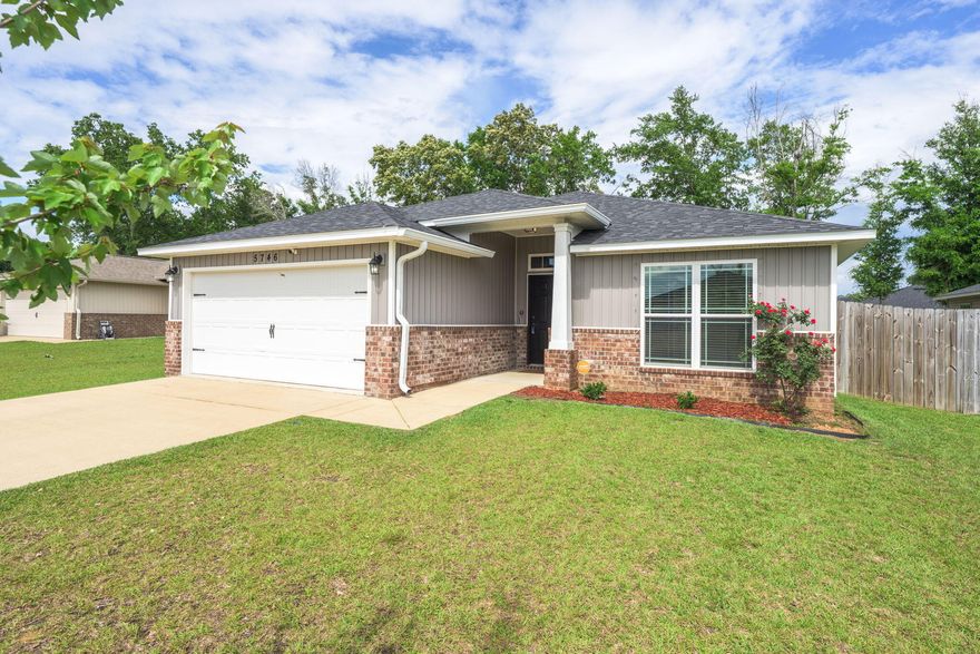 Welcome to this beautifully maintained 3-bedroom, 2-bathroom home nestled in the highly sought-after neighborhood of The Woodlands in Pace. Built in 2020, this home offers modern comforts and style with a 5-year-old HVAC system, water heater, and roof, ensuring peace of mind for years to come. The community boasts outstanding amenities including a park, splash pad, nature trail, and sidewalks throughout--perfect for outdoor enjoyment and active living. Inside, you'll find a warm and inviting open floor plan featuring soaring vaulted ceilings and charming plant ledges in the spacious living room. The kitchen is a standout with sleek white cabinetry, stainless steel appliances, granite countertops, and a breakfast bar--perfect for entertaining or casual meals. Adjacent is a bright and airy di ning area framed by large windows and double doors that flood the space with natural light. The primary suite is a true retreat, complete with tray ceilings and access to a luxurious bathroom. Enjoy double granite vanities, a tiled standing shower, a garden tub, private water closet, and a generous sized walk-in closet. The split floor plan provides privacy, with two additional bedrooms and a full bathroom located on the opposite side of the home. Step outside to a fully fenced backyard featuring mature trees, a cozy fire pit, and a covered patioideal for relaxing or entertaining. Conveniently located near I-10, shopping, dining, and entertainment, this home offers the perfect blend of comfort, style, and accessibilityready for you to move in and enjoy.