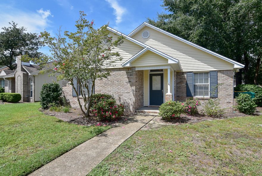 This is a great home in a great location! The home is filled with natural light and the living area has cathedral ceilings as well as a gas fireplace. The updated eat-in kitchen features  stainless steel appliances and granite counter tops.  You'll love being close to  Bluewater Elementary and the shops, restaurants and other amenities in Bluewater Bay. The Parkwood HOA maintains the front yard, landscaping, mulch and sprinkler system.  Come take a look today!