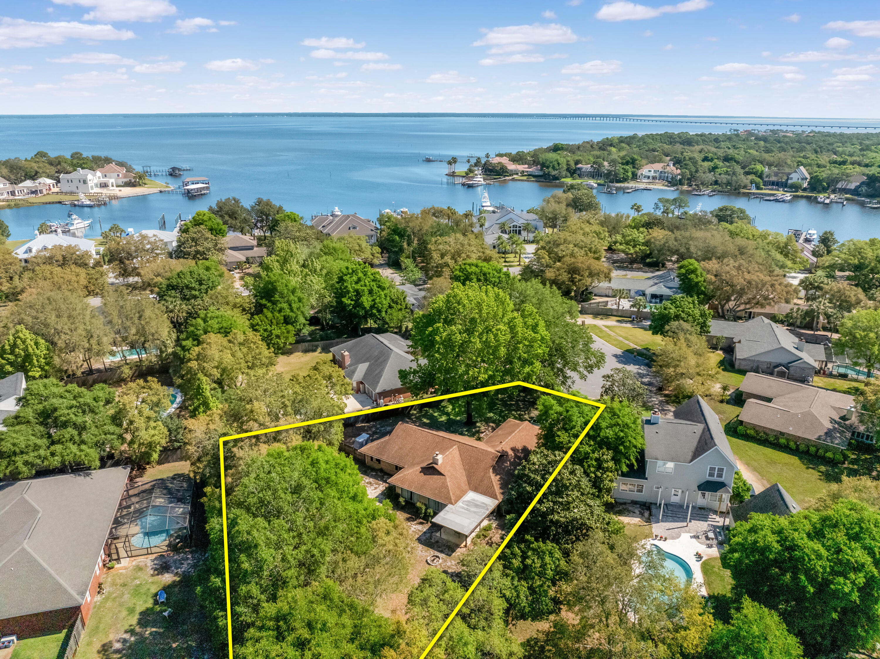 POTENTIALLY VA-ASSUMABLE MORTGAGE at 2.25%!! Extraordinary opportunity to acquire a one level home oriented on over a valuable and rare half-acre, cul-de-sac lot in the desirable golf and country club community know as Indian Bayou in Destin, Florida! This home has been upgraded with wonderful features and finishes, including but not limited to new mechanical units. The enormous lot is a magnificent outdoor space to enjoy time with the family and entertaining guests. The side of the driveway offers a point of access to the backyard, perhaps providing a perfect space to accommodate your boat or RV/motorcoach. The home was constructed with excellent integrity, which includes brick. The interior floorplan is quite accommodating, also offering...