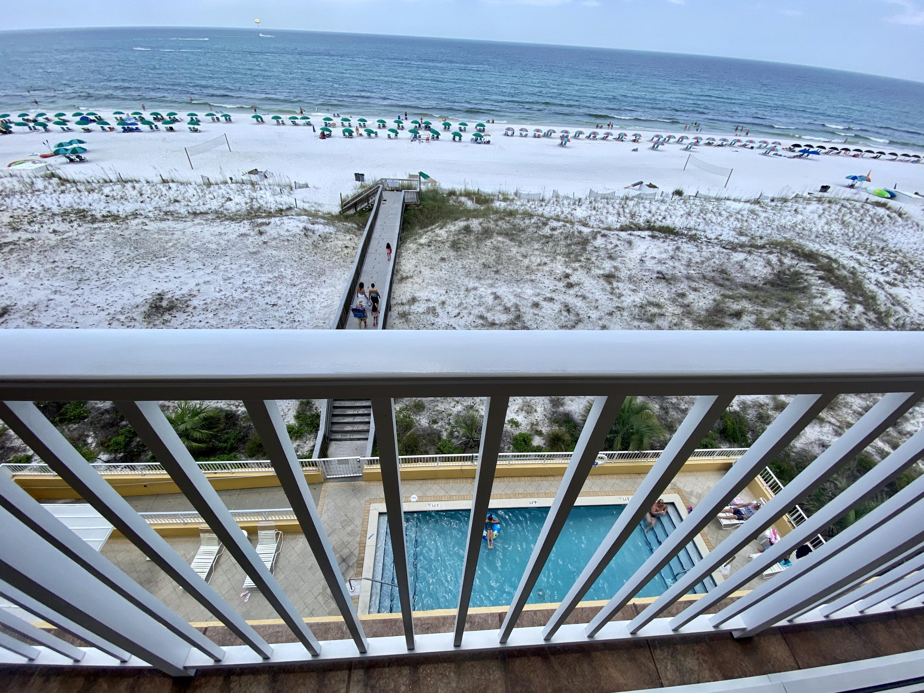 PANORAMIC UNOBSTRUCTED GULF VIEWS, remodeled 5th floor unit with 2 bedrooms PLUS a Bunkroom with a window, a GULF FRONT Master bedroom and deeded covered assigned parking. This is an owner occupied unit (non rental) that has been well cared for! Owners have installed high end kitchenaid stainless steel appliances, updated LVP flooring, and both bathrooms were totally remodeled and feature walk in showers. The oversized balcony features sliding door access from both the living room and the master bedroom, and offers views of the Okaloosa Pier, amazing sunsets, and the beautiful emerald coast waters as far as the eye can see. This unit features hurricane shutters and a fire suppression sprinkler system for peace of mind and lower insurance costs. Gulf Dunes features 2 pools, tennis courts,