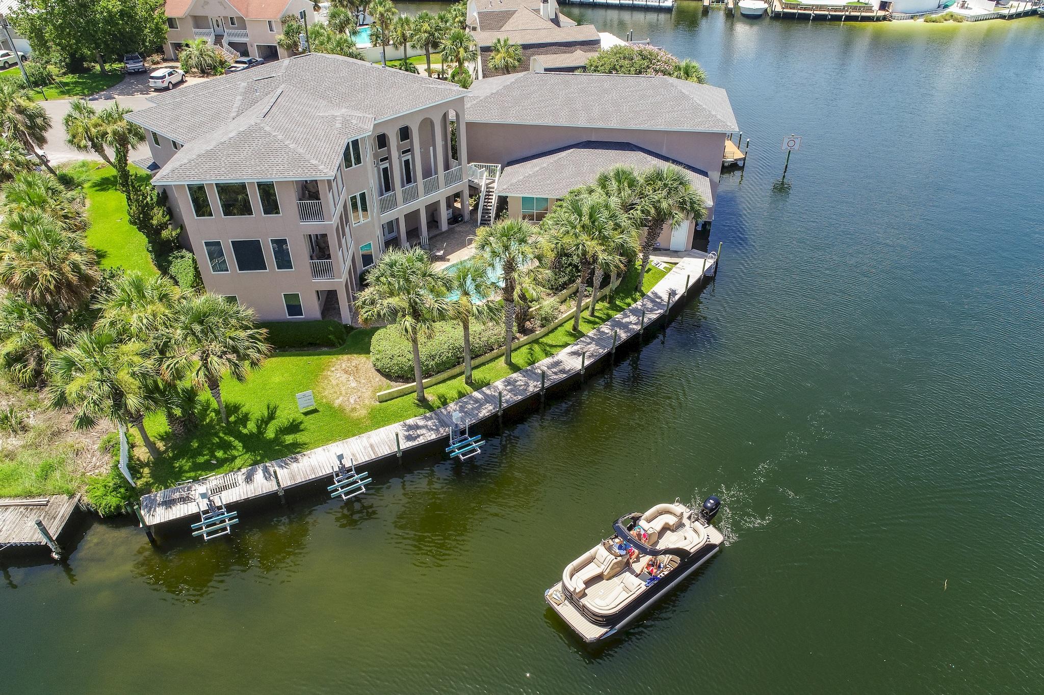 Welcome to the New 500 Osceola! One of the most Prestigious and Well Known Homes of Holiday Isle has a new look! From the Roof to the bottom floor has been replaced or updated! The Home which is known by many as ''The Yachtsman Home'' can now be known for so much more. After many months of work, the home will be known for its Coastal Chic and Contemporary beauty. This home boasts 191 feet of water frontage, 3 Sea-doe lifts and the amazing Yacht Garage which will hold a 57 Boat and a lift in the adjacent stall that will accommodate easily a 35' boat. The home has 4 large bedrooms, office, formal dining, an entertainment room off of the pool, a commercial elevator and the list goes on and on. Professionally and Beautifully furnished for the most indiscriminate of Buyers!