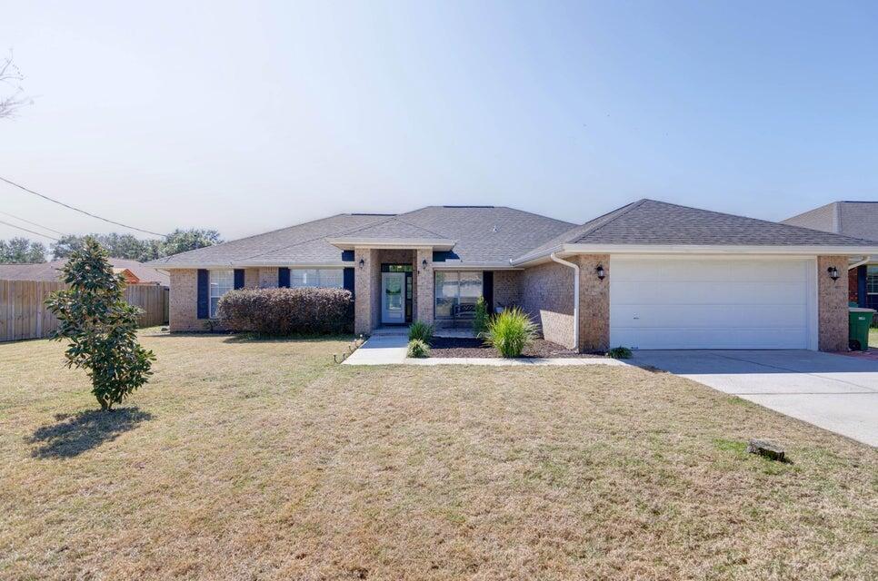Available in JULY!Welcome home to this stunning and spacious all brick east Navarre home! Featuring four bedrooms PLUS a formal dining room AND a massive bonus room with a huge backyard. Located just minutes from Navarre's beautiful beaches and a short drive to Hurlburt Field. Upgraded kitchen where you'll find custom cabinetry (extended to allow plenty of storage and prep space!) with tasteful granite countertops and modern backsplash. Master bedroom features two separate walk in closets, a soaking tub and separate shower. Contact Navarre Beach Realty at 850-936-0700 or come by the office at 8666 Navarre Parkway in the Winn Dixie Shopping center. Office hours are Monday-Friday 9am-5pm. No weekend showings. This home is currently a vacation rental until July. Appointments are required.