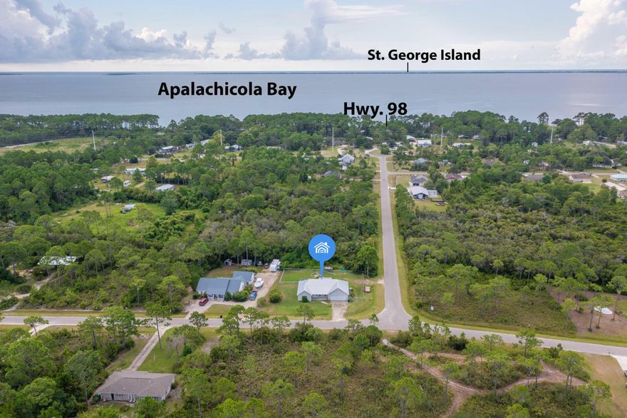 Residing on an acre awaits this spacious, charming craftsman-style home just minutes from the bay and beach. Upon initial entry, you are greeted with an open floor concept featuring an abundance of natural light, tall ceilings, and newly installed luxury vinyl plank flooring throughout. A spacious kitchen boasts custom cabinetry, breakfast bar, and a great appliance package with brand new stove (on order). The formal dining room overlooks the spacious newly fenced  back yard with adjoining screened-in porch creating a true continuation of living space. The intimate main suite encompasses a private ensuite and walk-in closet. Two more  guest bedrooms complete the residence along with an additional full bathroom. The attached two-car garage and oversized driveway provide ample storage. Inquire today to schedule a private viewing!