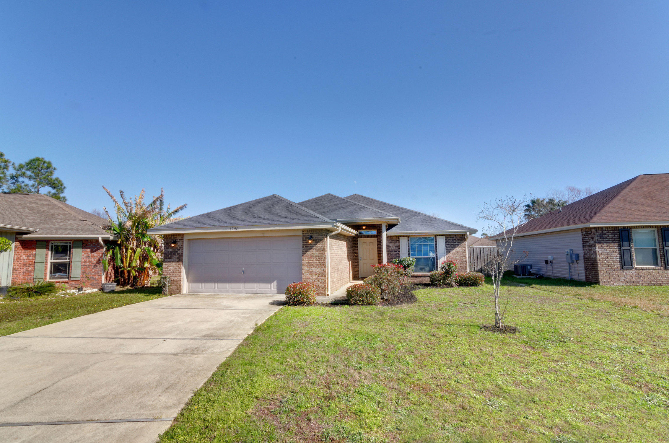 Welcome Home. This all brick oxford plan features a water view that can be enjoyed from the rear covered porch! Solid wood, upgraded cabinet, smooth top range and built in microwave are featured in the roomy kitchen. Double vanities, garden tub, separate shower and his & hers walk-in closets await you in the master bath! Other features of this beautiful home include Orange peel ceilings, craftsman style interior doors, elongated commodes, finished garage with coach lighting, sodded lawn with sprinkler system, vinyl dual pane windows and hurricane shutters. The neighborhood features underground utilities, sidewalk, community playground and picnic area. Don't miss out on this beautiful home!!Buyer's Agent to verify all square footage.
