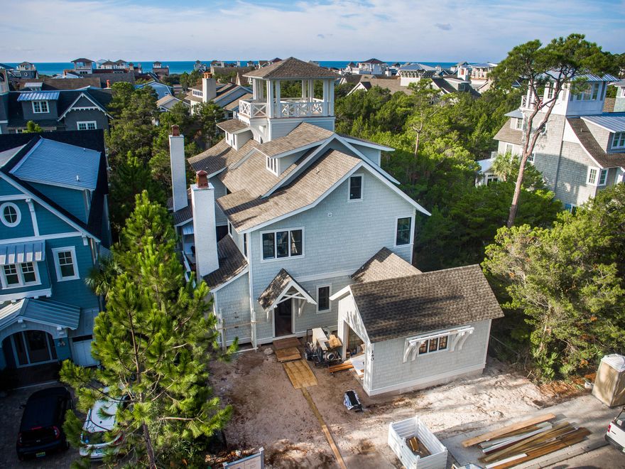 This custom designed residence in WaterSound Beach is truly amazing. The interior selections are a refined sophistication evident throughout the home. One immediately appreciates the skillful millwork in the trim, moldings, doors & cabinetry. There is an abundance of natural light streaming through the plethora of windows accenting the wood flooring. The private outside retreat includes a covered porch with plenty of space for entertaining around the fireplace, summer kitchen & saltwater pool. Enjoy the Gulf of Mexico views from the tower. Other upgrades include marble bathrooms, Wolf & Subzero appliances, reclaimed wood beams, multiple wet bars & bifold glass doors. This spectacular beach home exudes a relaxed ambience which is unique & refreshing! Completion date is end of January.