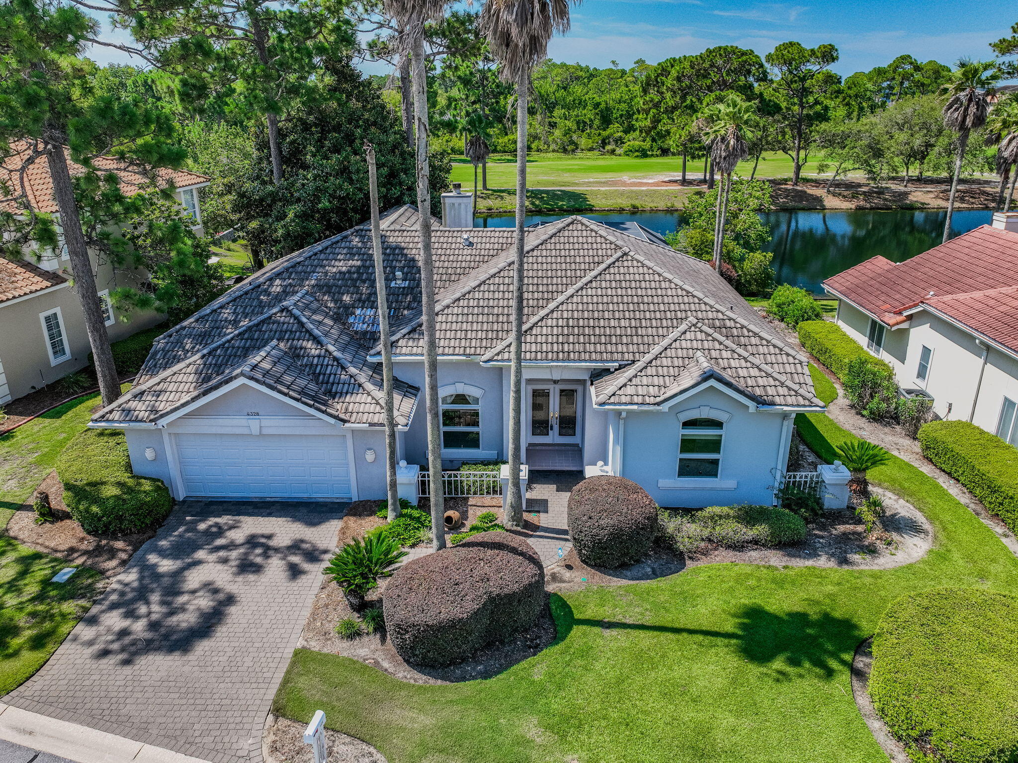 Excellent Location! This waterfront home is located in the beautiful mediterranean style neighborhood of Sunset Beach within the gated Bluewater BayGolf Course Community of Southwind. Situated in one of Niceville's most desirable neighborhoods, this 3-bedroom, 2-bathroom home offers 2,350 square feet of living space on a well-maintained 0.25-acre lot. This lovely home features a screened-in saltwater pool and an elevated hot tub overlooking the pretty lake. The pool is also heated so you can enjoy it year round. Would you rather spend your weekends at the beach instead of mowing the lawn, no problem as lawn maintenance and irrigation are included in your HOA dues! Plus, you will also enjoy access to Sunset Beach's stunning Bayfront pool and clubhouse, great for private gatherings and neighborhood events.
The mature landscaping and paver driveway create a welcoming first impression, while the open-concept floor plan allows for comfortable everyday living and entertaining. The home is filled with lots of natural light, creating a bright and inviting atmosphere. Inside, you'll find durable tile flooring throughout the main living areas, a gas fireplace in the living room, and custom built-in shelving. The layout flows easily from the dining room to the kitchen and main living space, making the most of the natural light and water views.
With a great layout and prime location, this home presents a unique opportunity to invest in a waterfront property and make it your own. Schedule a showing today to see the potential for yourself.