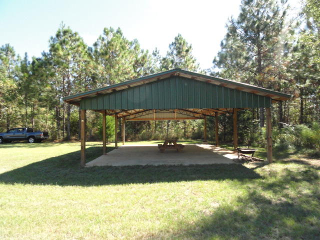 Looking for a nice level parcel to build your dream home? This one is partially cleared and almost ready to start building.The owner has a 24 x 36 Pole Barn on slab already in place, a 75' driveway is installed with culvert, a 10 x 20 Outbuilding for secure storage. He is also including a riding mower and lawn tools. There is a safe shooting area for the marksman to practice their skills. No water tap or electricity have been run to the property.