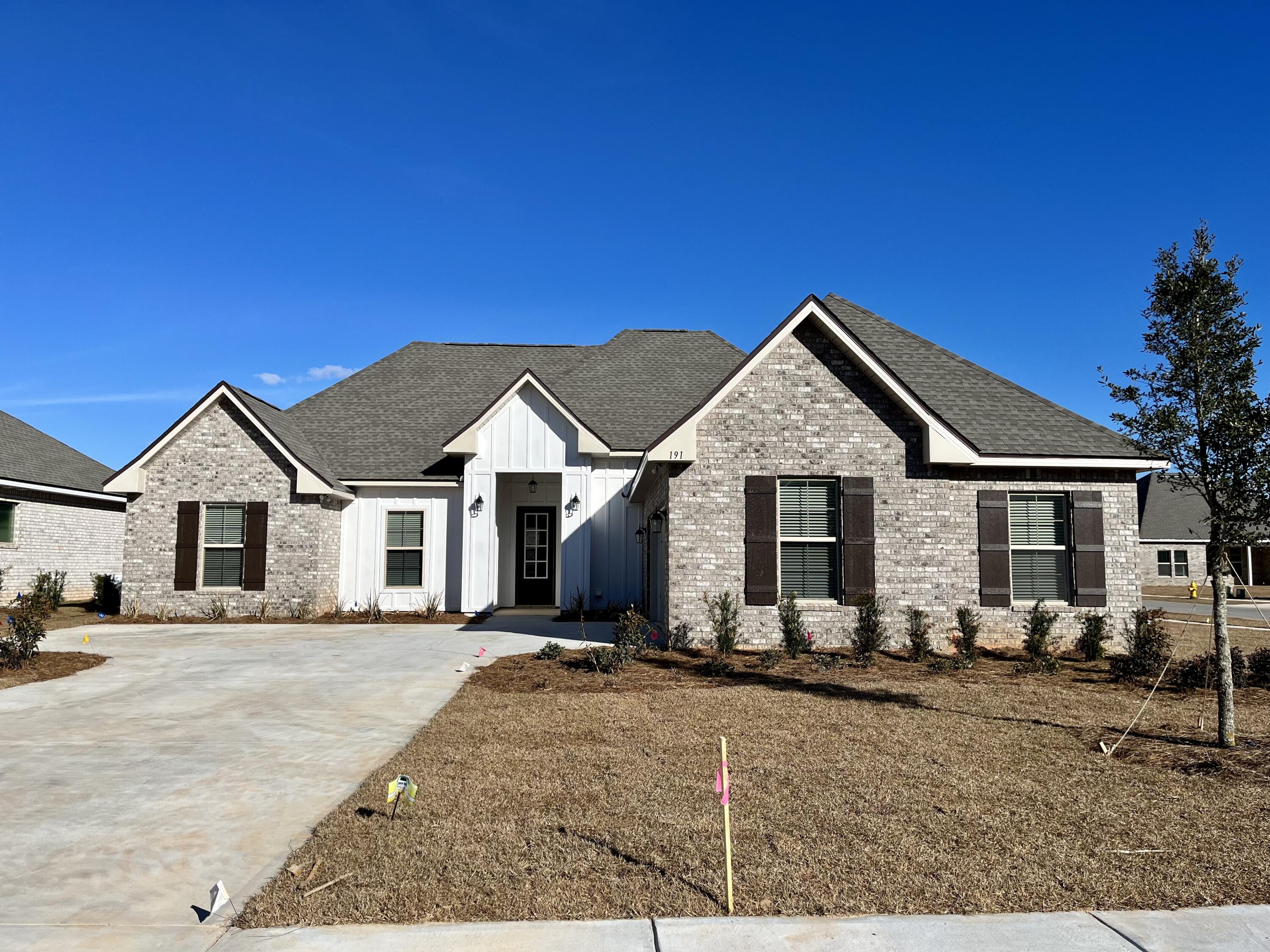 The CEZANNE IV G in The Trails at Hammock Bay community offers a 4 bedroom, 2 full bathroom, open and split design with a computer nook. Upgrades added (list attached). Special Features: double vanity, garden tub, separate custom tiled shower with frameless door, and walk-in closet in master bath, kitchen island, walk-in pantry, boot bench in mud room, covered patio, recessed lighting, undermount sinks, bronze plumbing fixtures, framed mirrors, smoke/carbon monoxide detectors, landscaping, architectural 30-year shingles, flood lights, and more!Energy Efficient Features: tankless gas water heater, kitchen appliance package with gas range, low E-MI windows, and more!