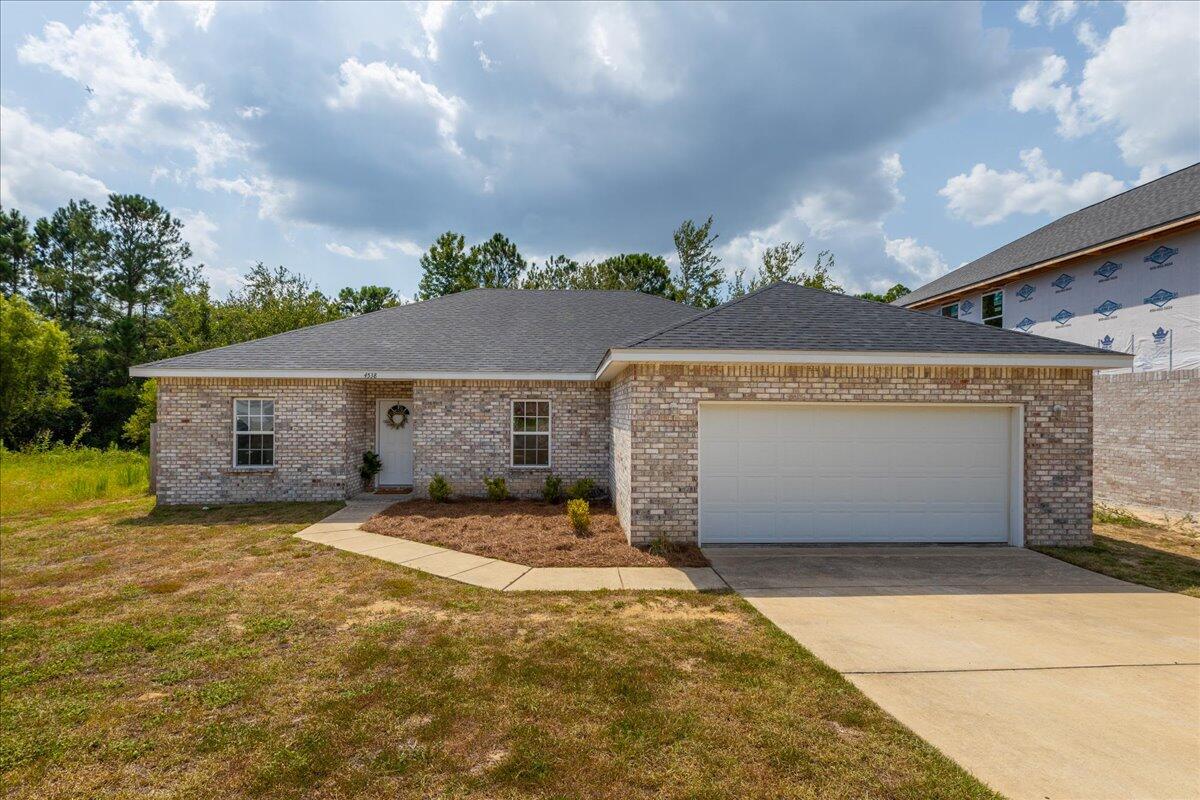 **LOCATION, LOCATION, LOCATION!** Stunning 4 year old brick 3-bedroom, 2-bath home in Duggan Pond Estates, South of Crestview, now available! Originally a 4-bedroom design, one bedroom has been converted into a dining room but can easily be reverted. Built in 2020 with 1,875 sq ft of living space, this home features an open floor plan, split bedrooms, and a fenced backyard perfect for entertaining. The kitchen boasts stainless steel appliances, and you'll appreciate the tile flooring in the kitchen and baths, plus carpet in the bedrooms.  Conveniently located just 10 minutes from 7th Special Forces & Duke Field and 15 minutes to Eglin AFB. Close to grocery stores & restaurants, this beautiful home offers a perfect blend of comfort and accessibility. Don't miss this opportunity