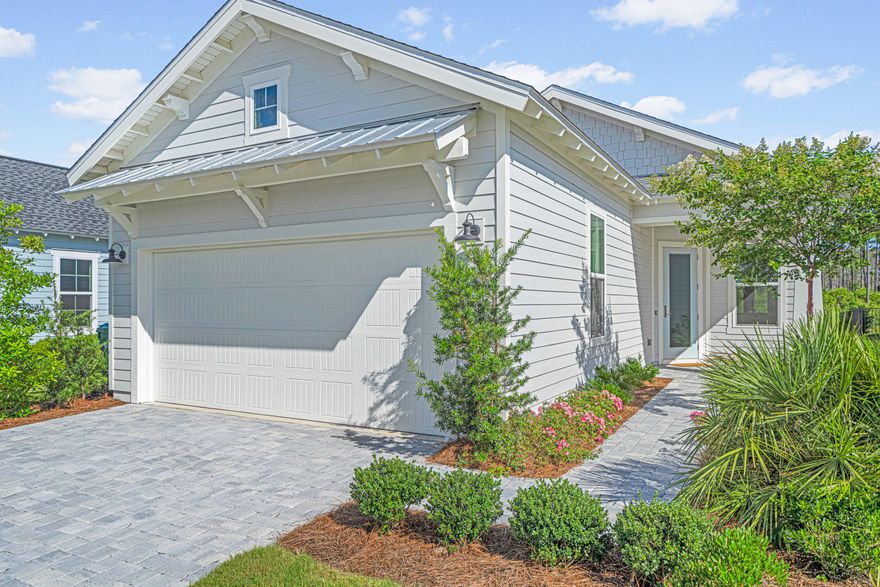 Experience the best of coastal living at this upgraded 3/2 located within one of the most sought-after master-planned communities, NatureWalk at WaterSound Origins. This gated neighborhood is a place where residents know each other by name, kids still ride bikes until the streetlights come on, and the simple joys of barefoot summers and ice cream runs are a cherished evening ritual. With access to unparalleled amenities, including a resort-style swimming pool and hot tub, fitness center, club house, playground, pickleball/tennis, and social area, an active lifestyle is easy. Residents also enjoy access to all of WaterSound Origins' amenities, including a 10-hole executive par-3 golf course, pool, and private access to Lake Powell. The sugar sands of 30A are minutes away! Built with many upgrades, this 2023 construction offers an exceptional lifestyle. Premium engineered Hardwood flooring flows throughout the bright and open floor plan, creating a warm and inviting space. The gourmet kitchen has waterfall quartz countertops, breakfast bar, stainless-steel appliances, a designer vent hood, and a beautiful tile backsplash that extends up the wall--blending functionality with style. Enjoy casual meals in the sunny breakfast nook. The open-concept design flows effortlessly into the living and dining area, which include custom roman shades. Plenty of room to entertain! Just off the garage there is a well-designed laundry room with built-in cabinetry-perfect for beach towels and everyday essentials.

The two guest bedrooms are thoughtfully positioned at the front of the home, offering generous space and a shared full bathroom,perfect for guests or family. The master bedroom is tucked away at the back of the home and features tray ceilings, black-out shades, and large windows with serene pond views. The master en suite is beautifully finished with a double vanity and a large, tiled walk-in shower, and also provides access to two spacious walk-in closets.

Step outside to your covered patio,a peaceful oasis for enjoying fresh air, whether it's sipping your morning coffee or relaxing in the evening.

This property includes a 2-car garage, offering ample space for parking as well as additional storage for tools. There is also a full irrigation system, making yard maintenance easy. With plenty of outdoor space, you can easily create your own garden or entertainment area, allowing you to fully enjoy the beautiful surroundings.

NatureWalk at Watersound Origins is a golf-cart friendly community, just minutes from Watersound Town Center, a quaint village hub filled with shops, restaurants, Starbucks, Publix, a bakery, and doctors' offices. Located just minutes from iconic Rosemary Beach and all that 30A has to offer, this home offers the perfect blend of luxury, convenience, and laid-back coastal lifestyle.

Don't miss this incredible opportunity-schedule your viewing today!