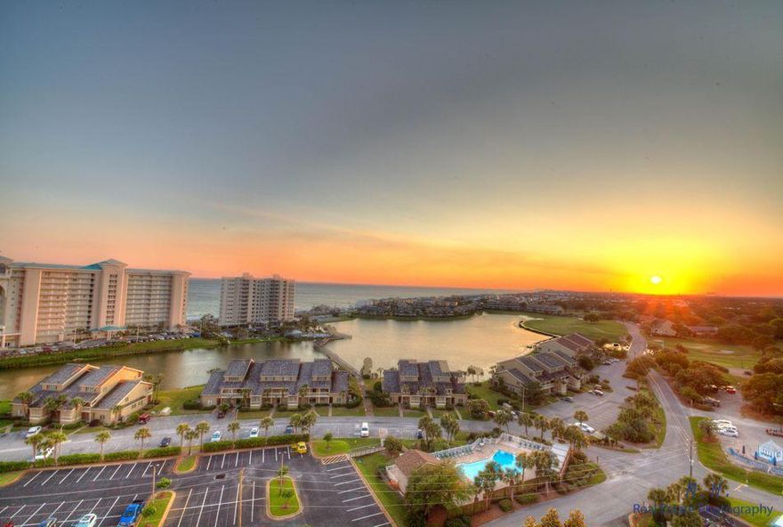 WELCOME TO PARADISE! Open the doors to the most spectacular views of the Emerald Coast's shoreline on the Gulf of Mexico.  Double the views w/Choctawhatchee Bay and panoramic views of Destin. Kick off your shoes and relax in this beautiful vacation condo with 9' ceilings, updated flooring, granite kitchen counter tops, NEW stainless steel appliances and an additional outside storage unit. Take a short four minute walk to the white sugar sand beach or simply hang out in the pool area with three large pools. Ariel Dunes II is located in Seascape Golf and Tennis Resort, a gated community offering amenities such as golf, tennis, pools, fitness center and conference center. What are you waiting for?! Check it out! Buyer to verify all information.